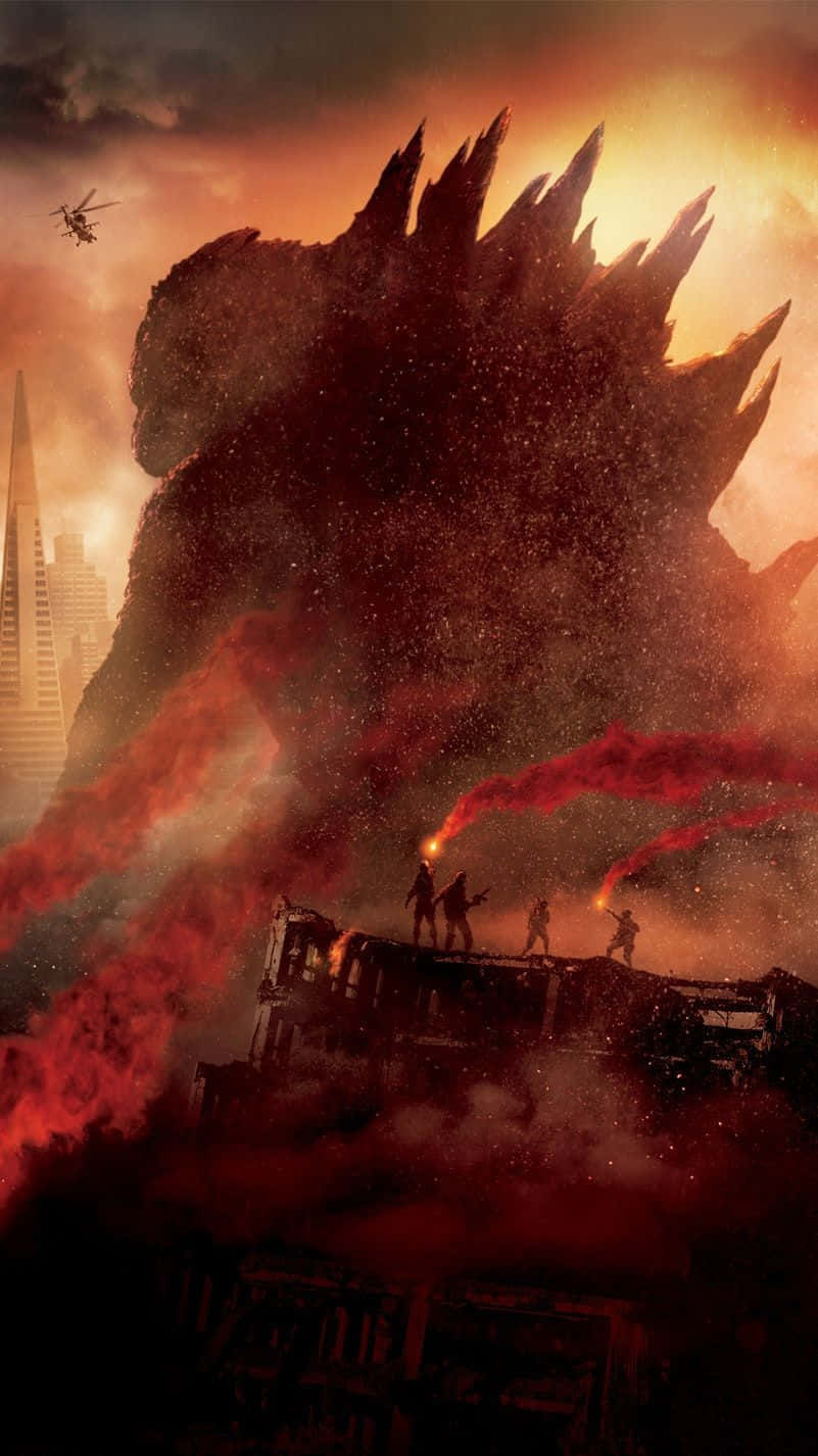 Godzilla 2014 桌布 壁紙 — 巨大的哥吉拉聳立在燃燒的城市上空，小小的士兵站在被毀的車輛上，面對著火紅的橙色天空，表現出挑釁的姿態。