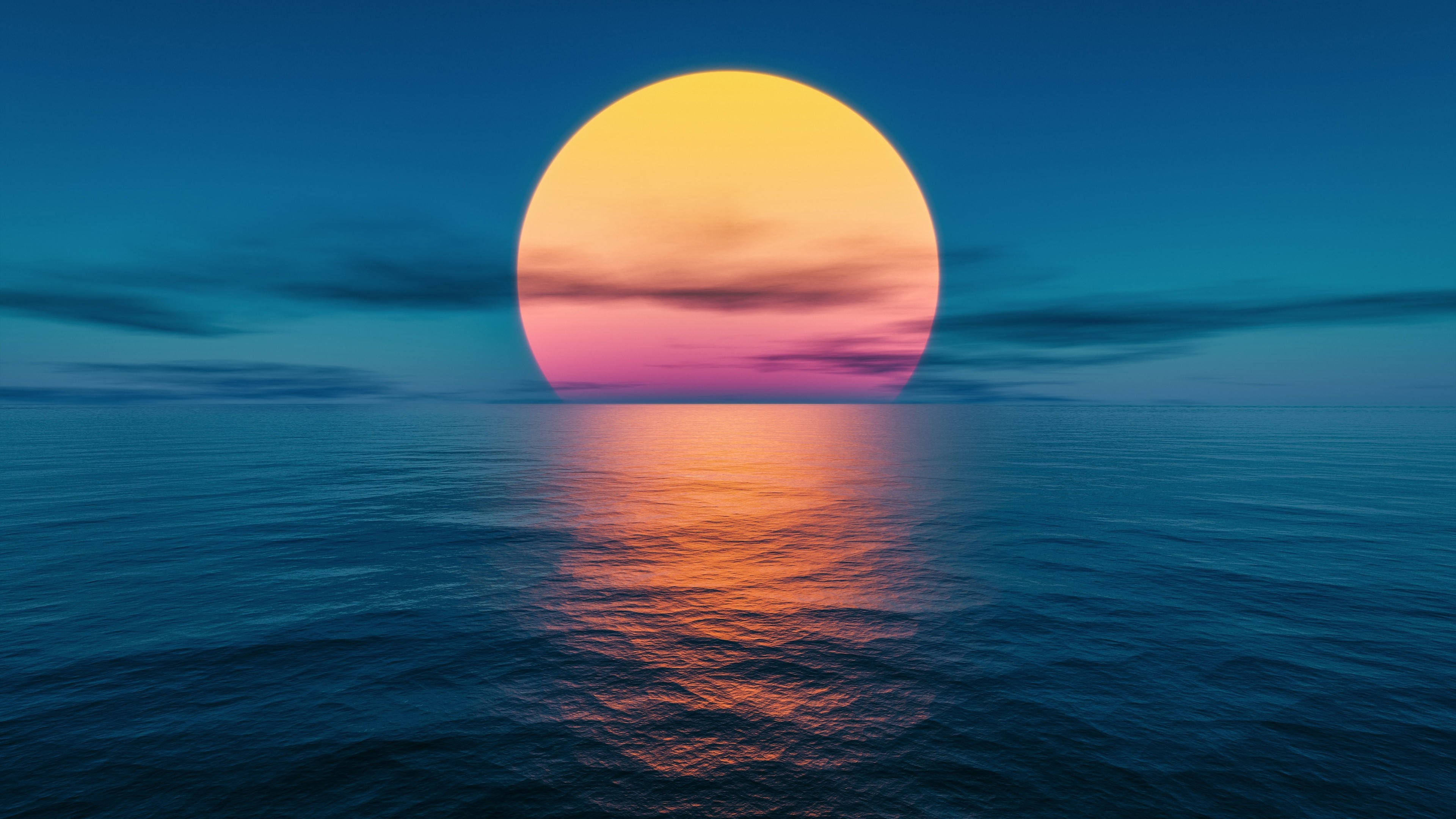 海洋 桌布 壁紙 — 巨大的太陽在平靜的海面上落下，在深藍色的天空和反射的水面上投射出溫暖的橙色和粉紅色調。