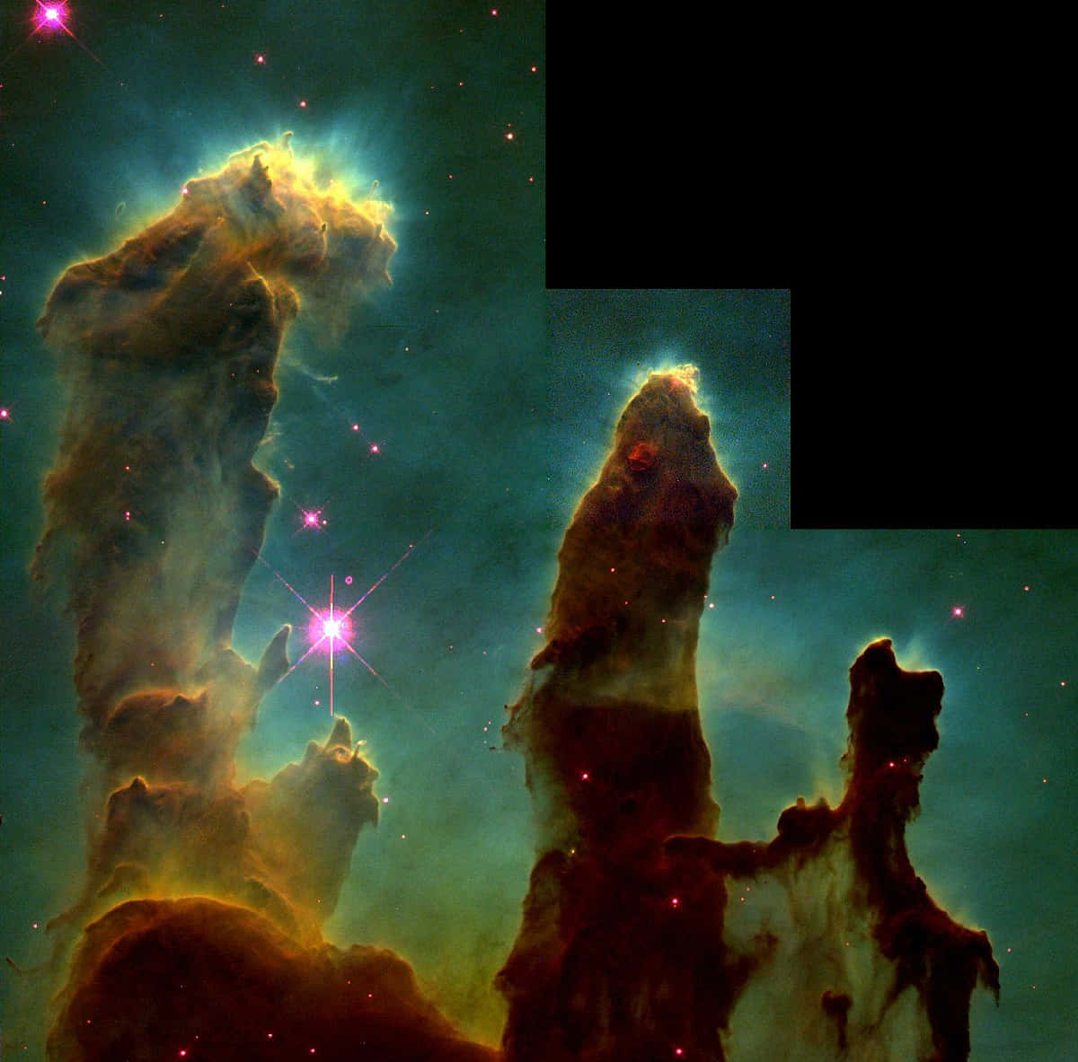 太空 桌布 壁紙 — 巨大的宇宙氣體和塵埃柱在星空中散發出充滿活力的青綠色和琥珀色光芒。
