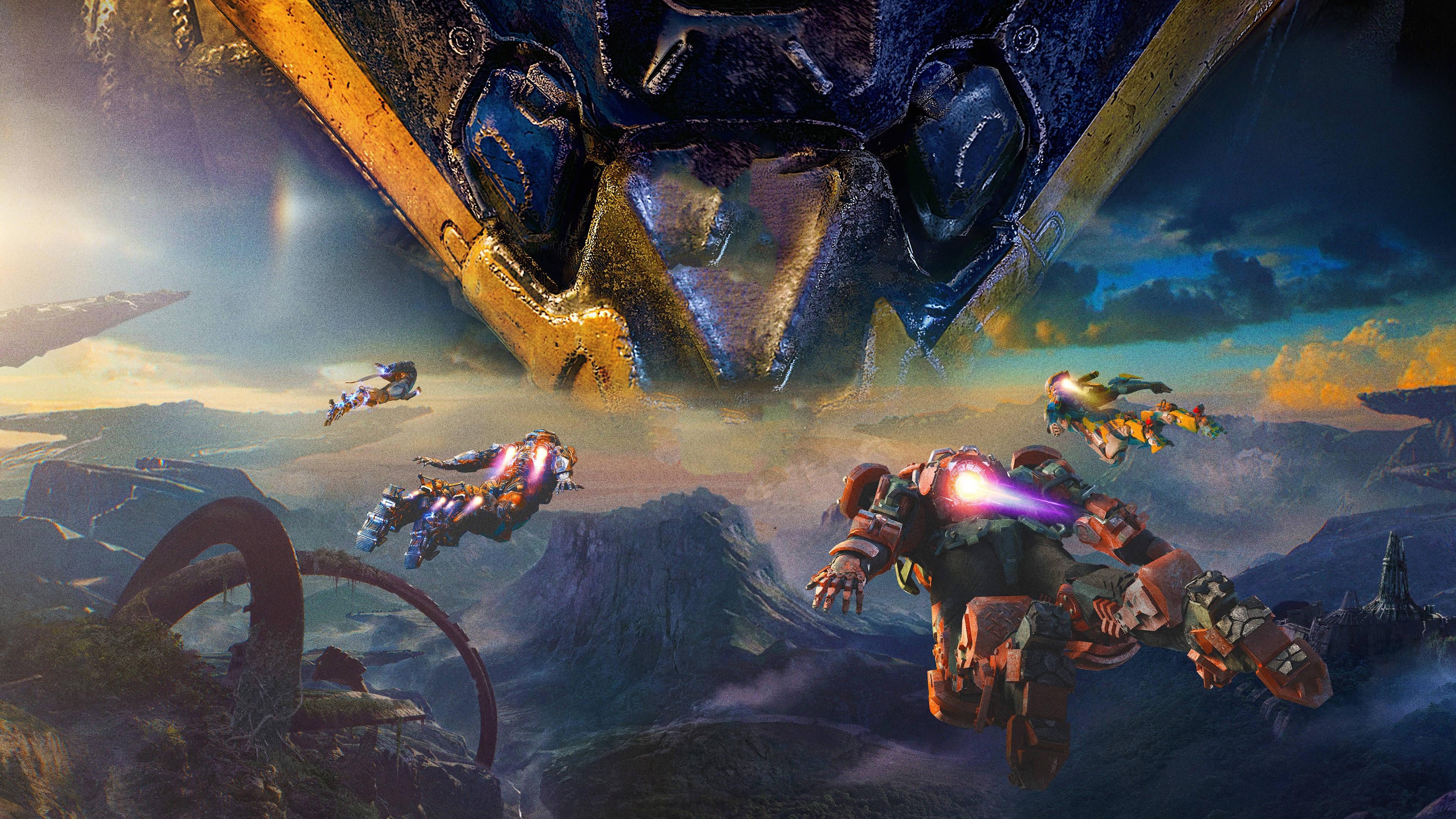 anthem 4K 桌布 壁紙 — 巨大的機械翅膀籠罩著山區景觀，裝甲飛行員在天空中翱翔，發射能量武器。