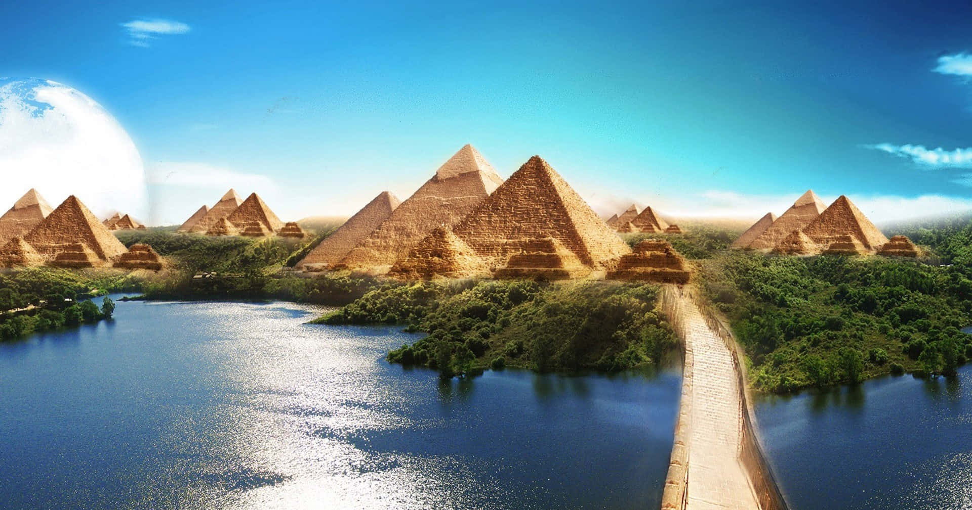 Clear 桌布 壁紙 — 巨大的金字塔從鬱鬱蔥蔥的綠色山丘中雄偉地升起，旁邊是閃爍的藍色湖泊，天空晴朗。