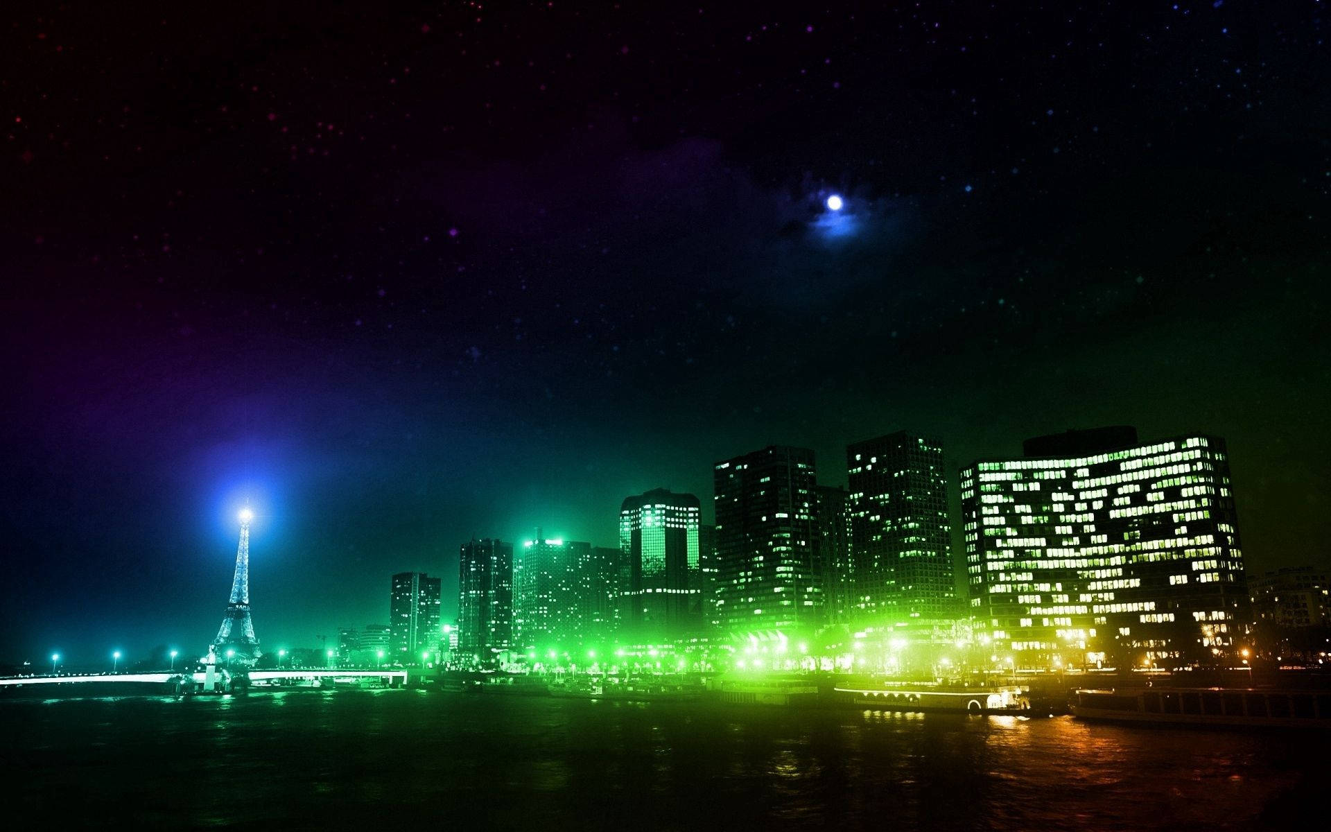 巴黎 桌布 壁紙 — 巴黎夜景天際線，艾菲爾鐵塔發出藍光，建築物在星空下閃耀著鮮綠色。
