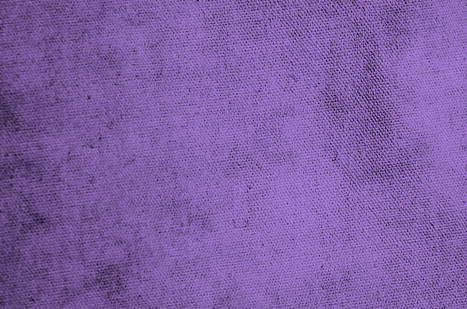 Purple Fabrics 桌布 壁紙 — 帶有微妙深色斑點和編織圖案的紋理紫色布料的特寫。