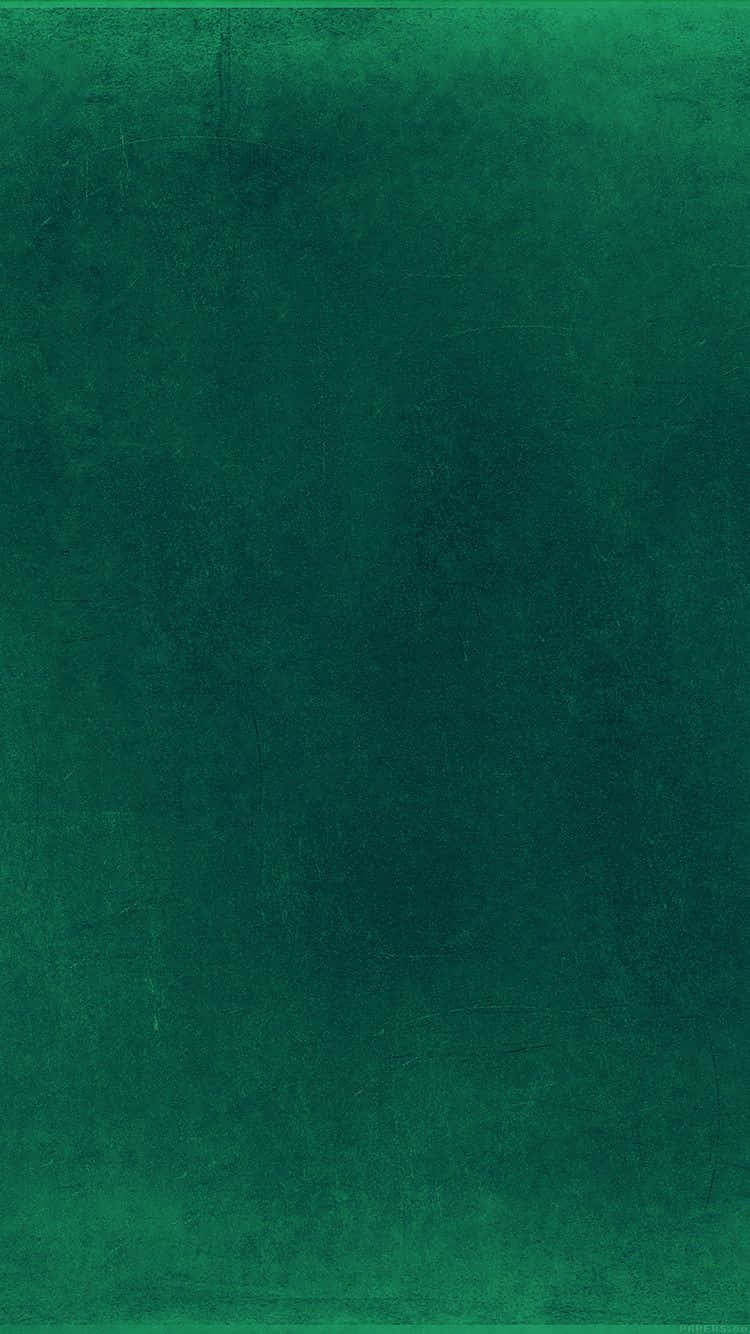 Emerald Green 桌布 壁紙 — 帶有微妙漸變和輕微刮痕的紋理深綠色抽象背景。