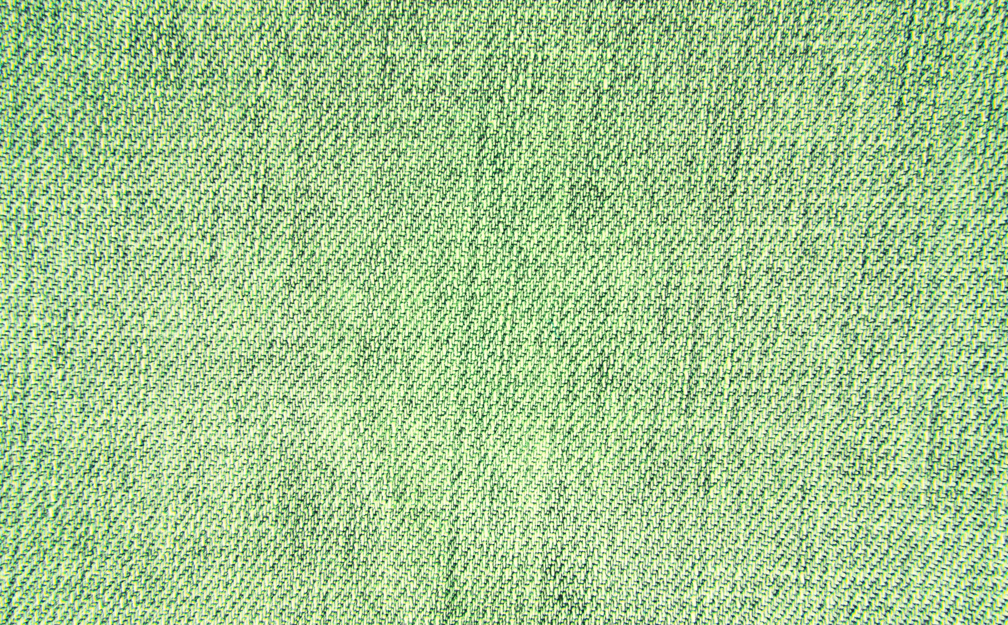 Fabric 桌布 壁紙 — 帶有微妙編織圖案和柔和光線的紋理綠色織物特寫。