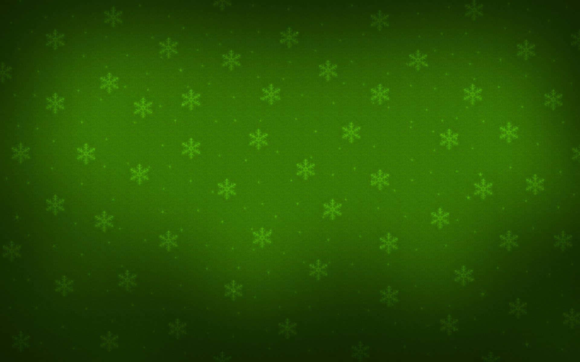 Dark Christmas 桌布 壁紙 — 帶有微妙雪花圖案和從中心柔和淡出光線的綠色漸變背景。