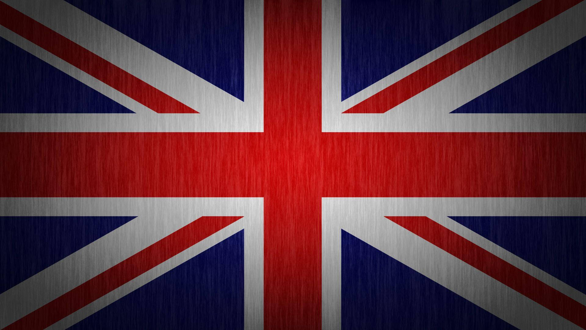 United Kingdom Flag 桌布 壁紙 — 帶有拉絲金屬紋理的英國國旗，顯示紅、白、藍條紋和十字。