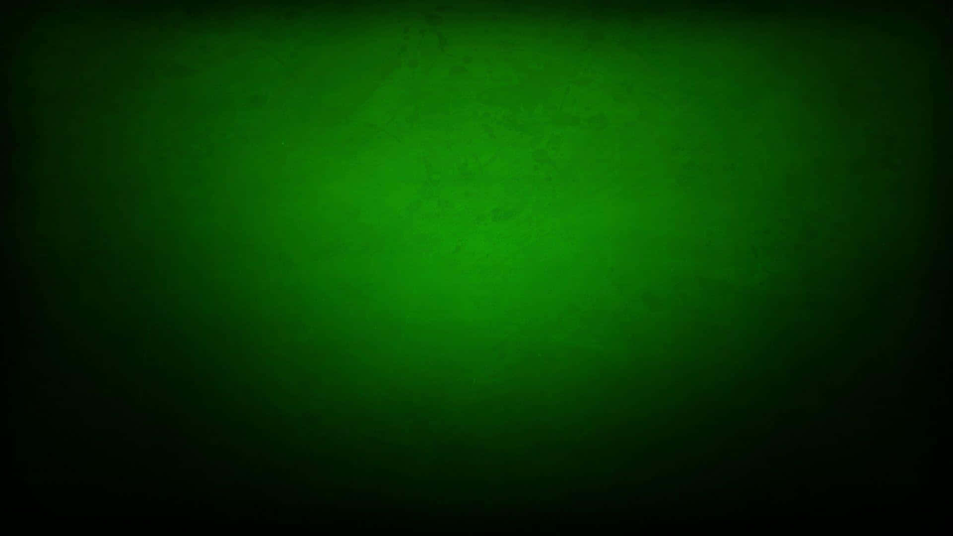 Green And Black 桌布 壁紙 — 帶有暗角及從中心向外漸淡的細微紋理的綠色漸變背景。