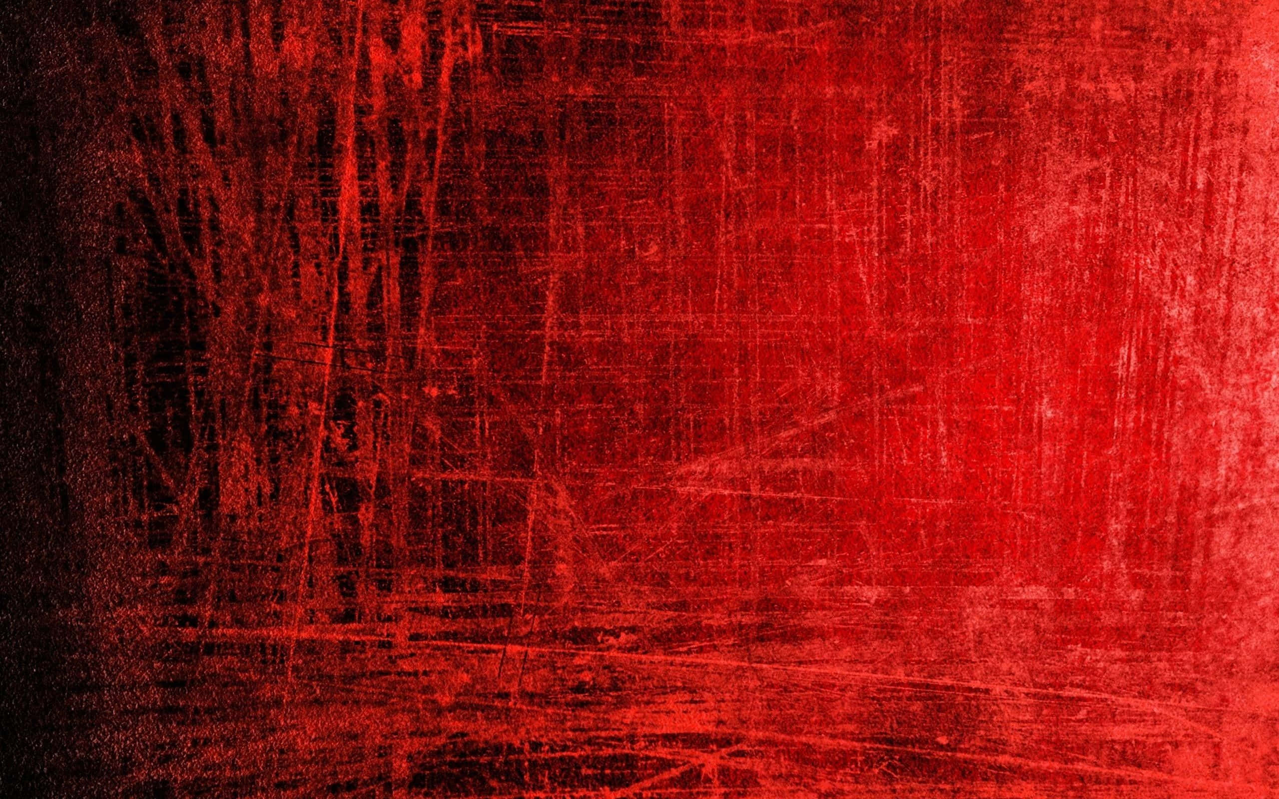 Red Grunge 桌布 壁紙 — 帶有深色條紋和刮痕的紋理紅色抽象背景，營造出粗獷的工業感。