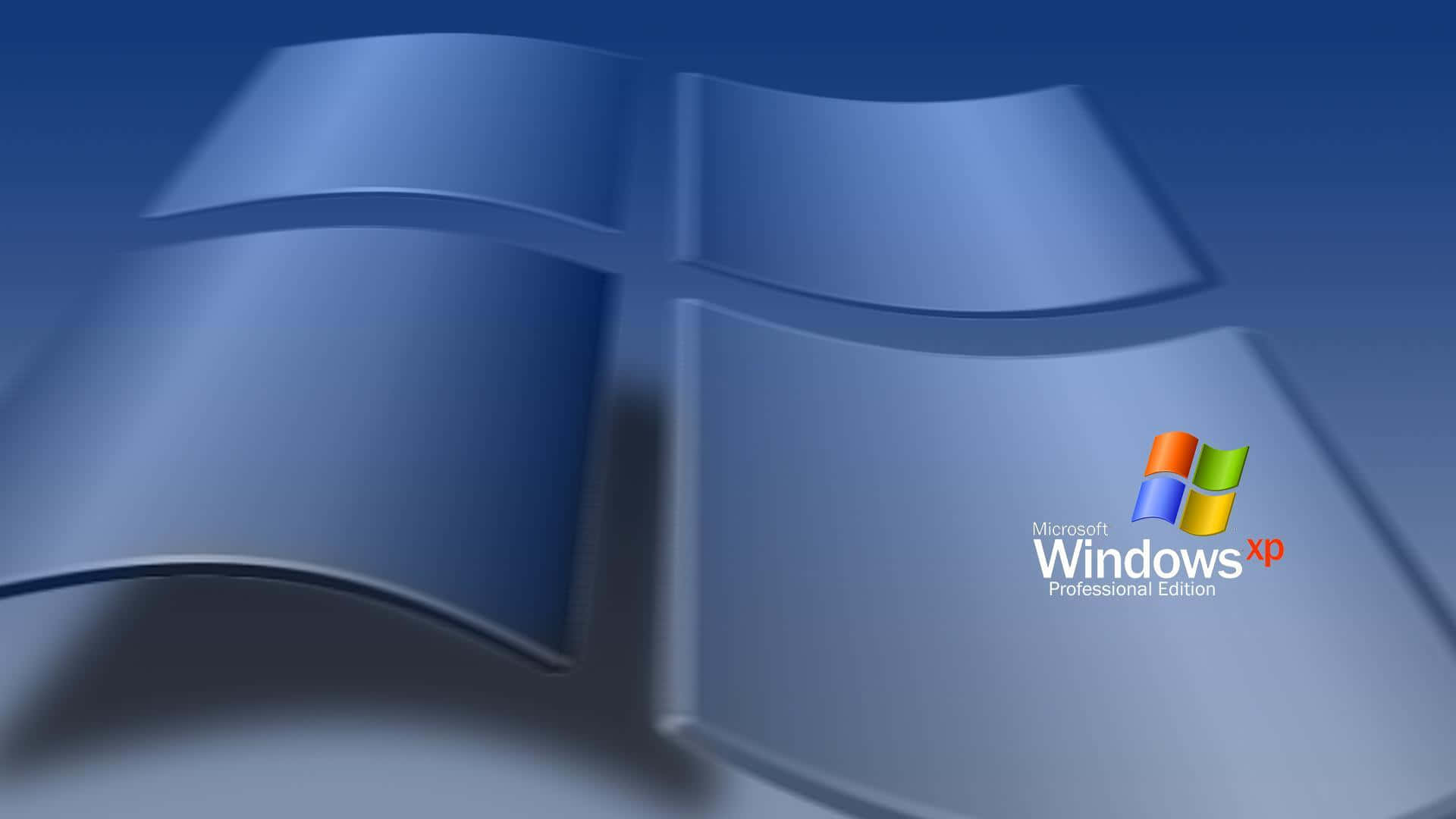 Windows XP 桌布 壁紙 — 帶有漸變背景和角落中 Microsoft Windows XP Professional Edition 文字的亮面藍色 Windows XP 標誌。