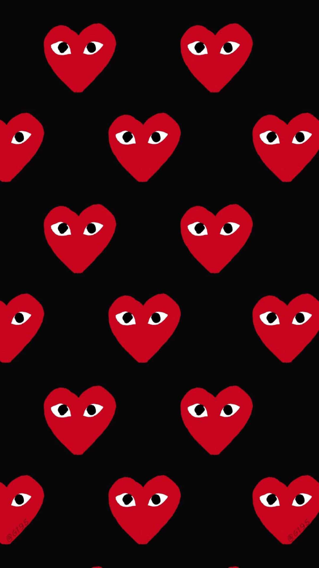 cdg 桌布 壁紙 — 帶有眼睛的紅色心形在黑色背景上以網格重複，形成大膽的圖案。