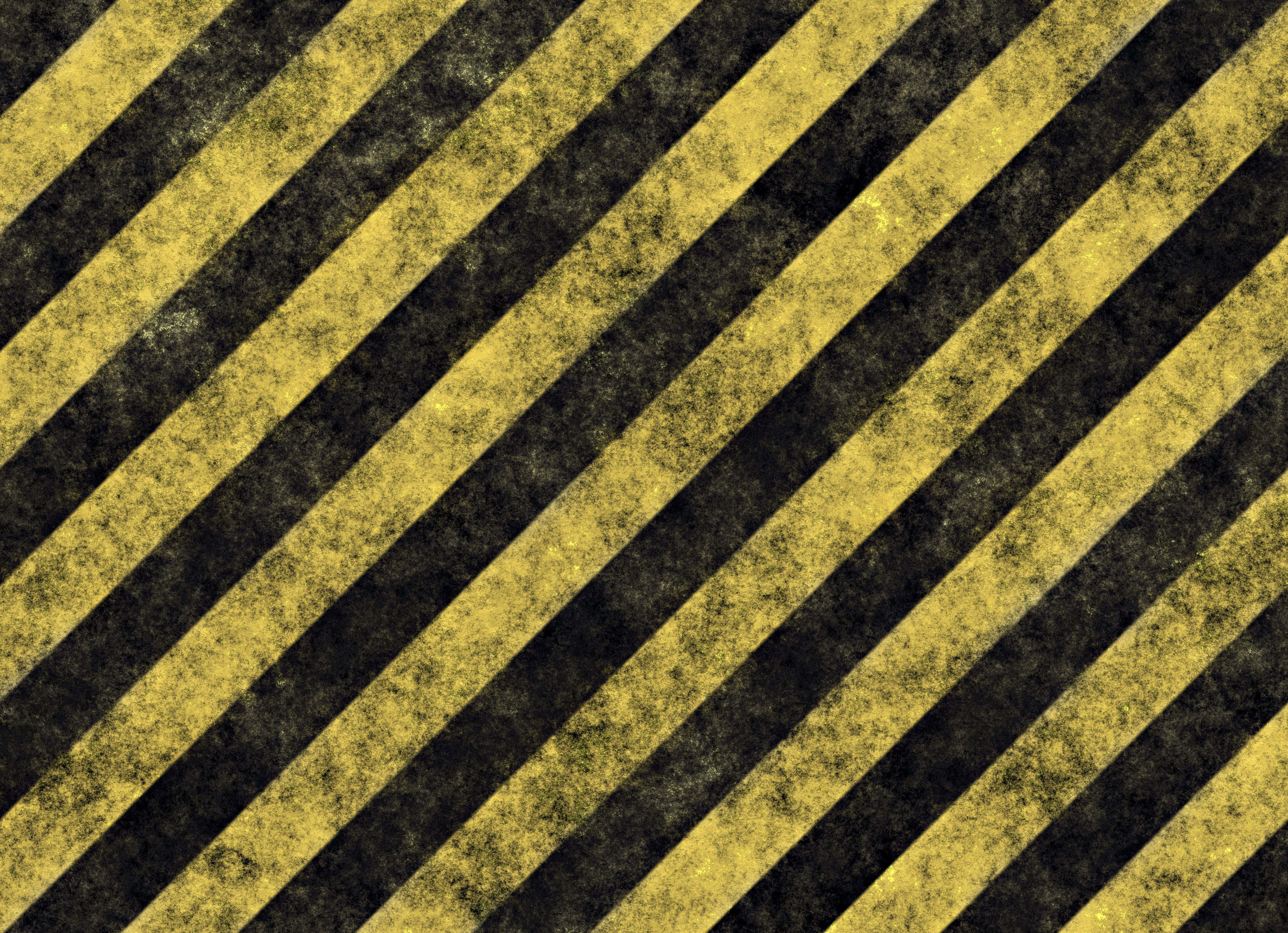 Yellow Striped 桌布 壁紙 — 帶有紋理、磨損油漆的對角黃色和黑色條紋，形成大膽的警示圖案。