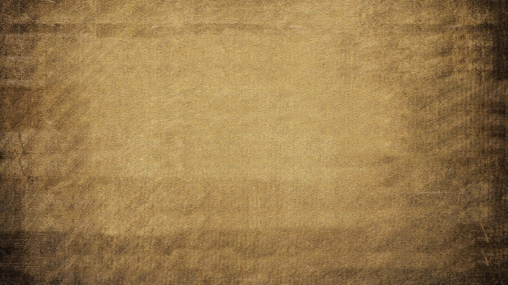Brown Paper 桌布 壁紙 — 帶有紋理的復古羊皮紙背景，呈現溫暖的大地色調，邊緣帶有微妙的漸層淡出效果。
