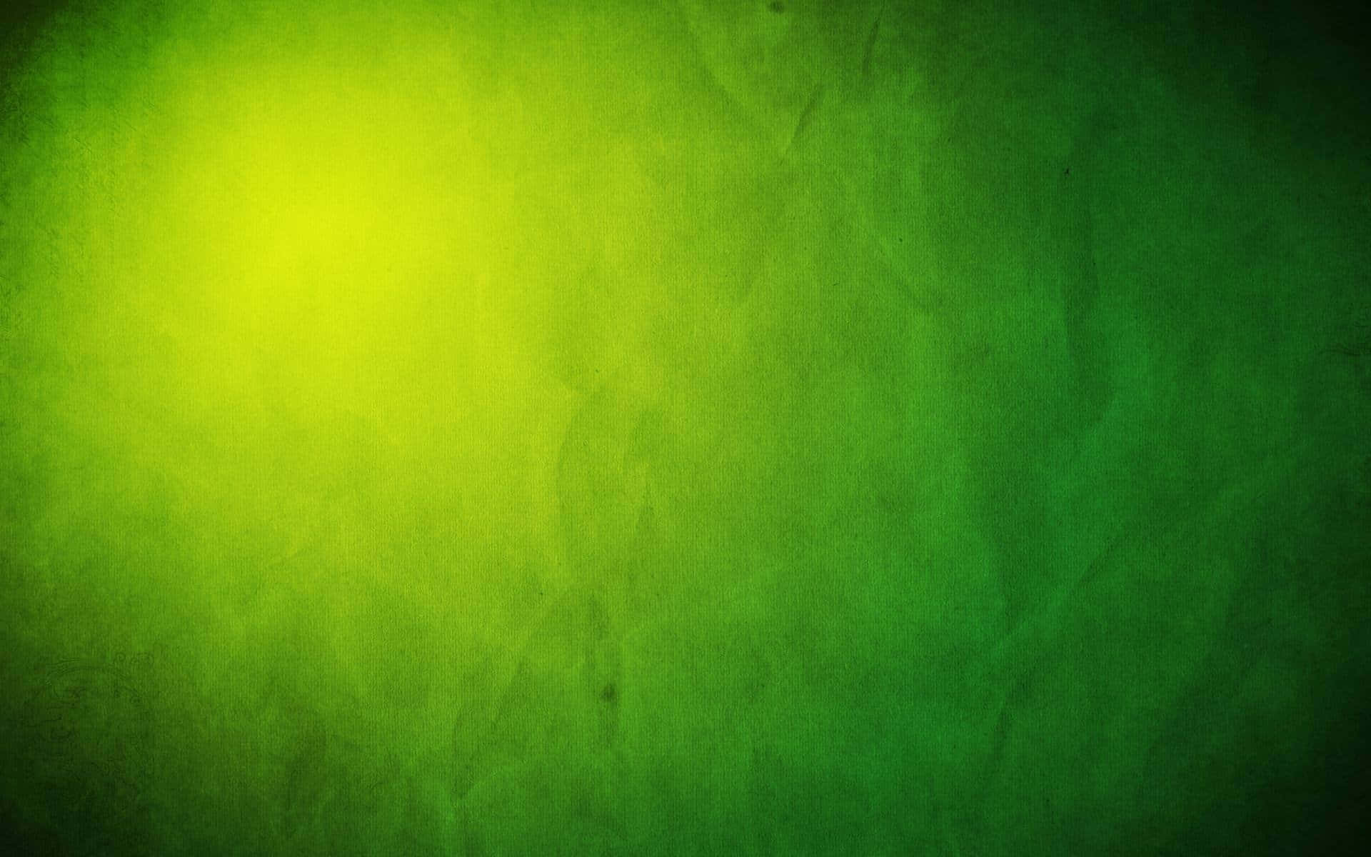 Dark Green Grunge 桌布 壁紙 — 帶有紋理的綠色漸變背景，從明亮的黃綠色漸變到深沉的森林綠色，帶有微妙的表面瑕疵。