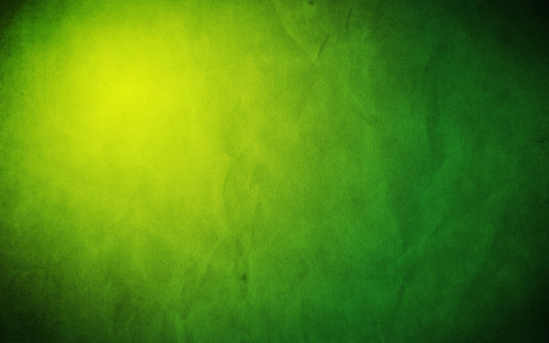 Gradient 桌布 壁紙 — 帶有紋理的綠色漸變背景，明亮的黃色光芒逐漸淡入較深的綠色色調。