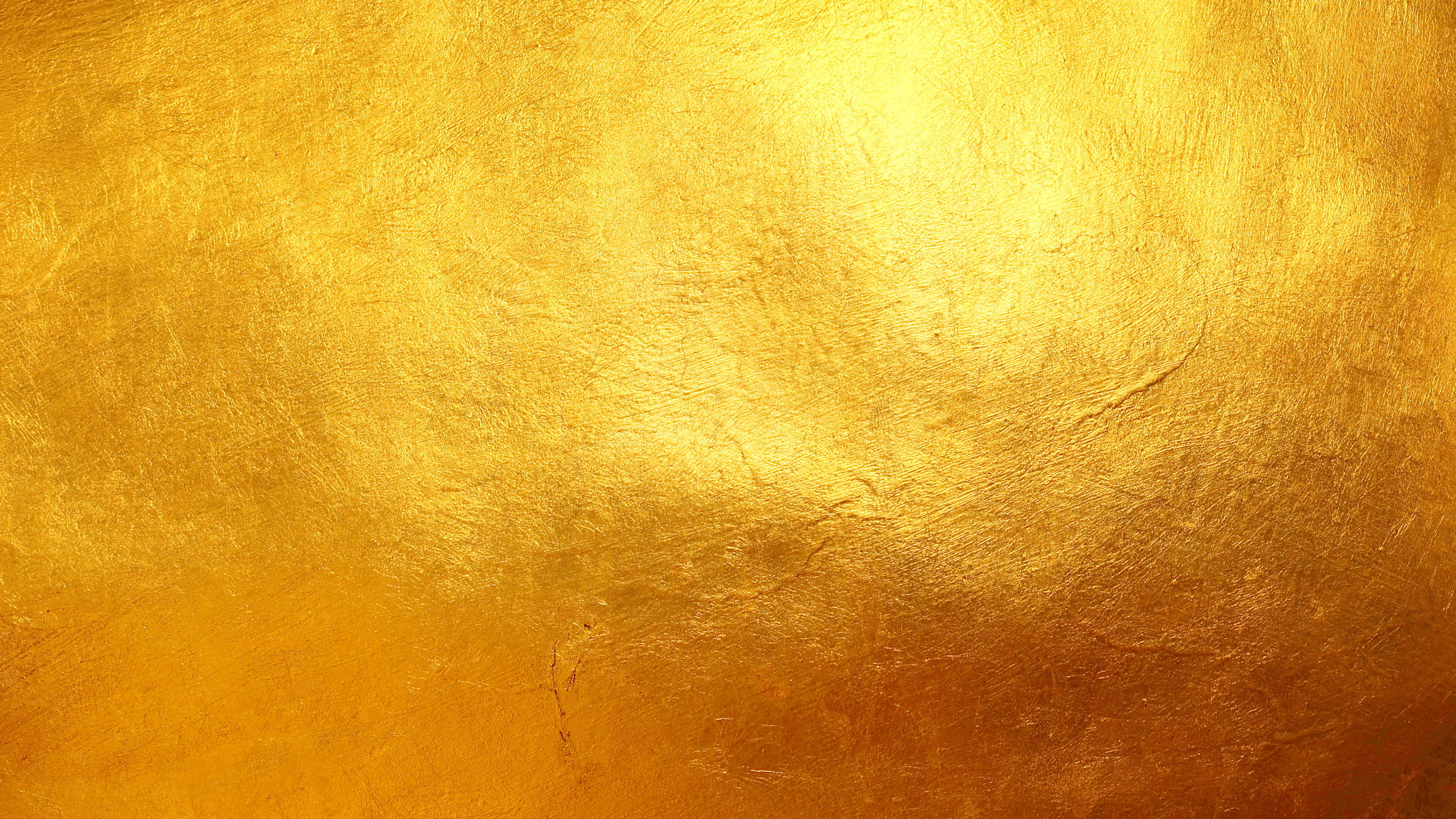 Golden 桌布 壁紙 — 帶有紋理金屬光澤和微妙漸變照明的閃亮金色表面。