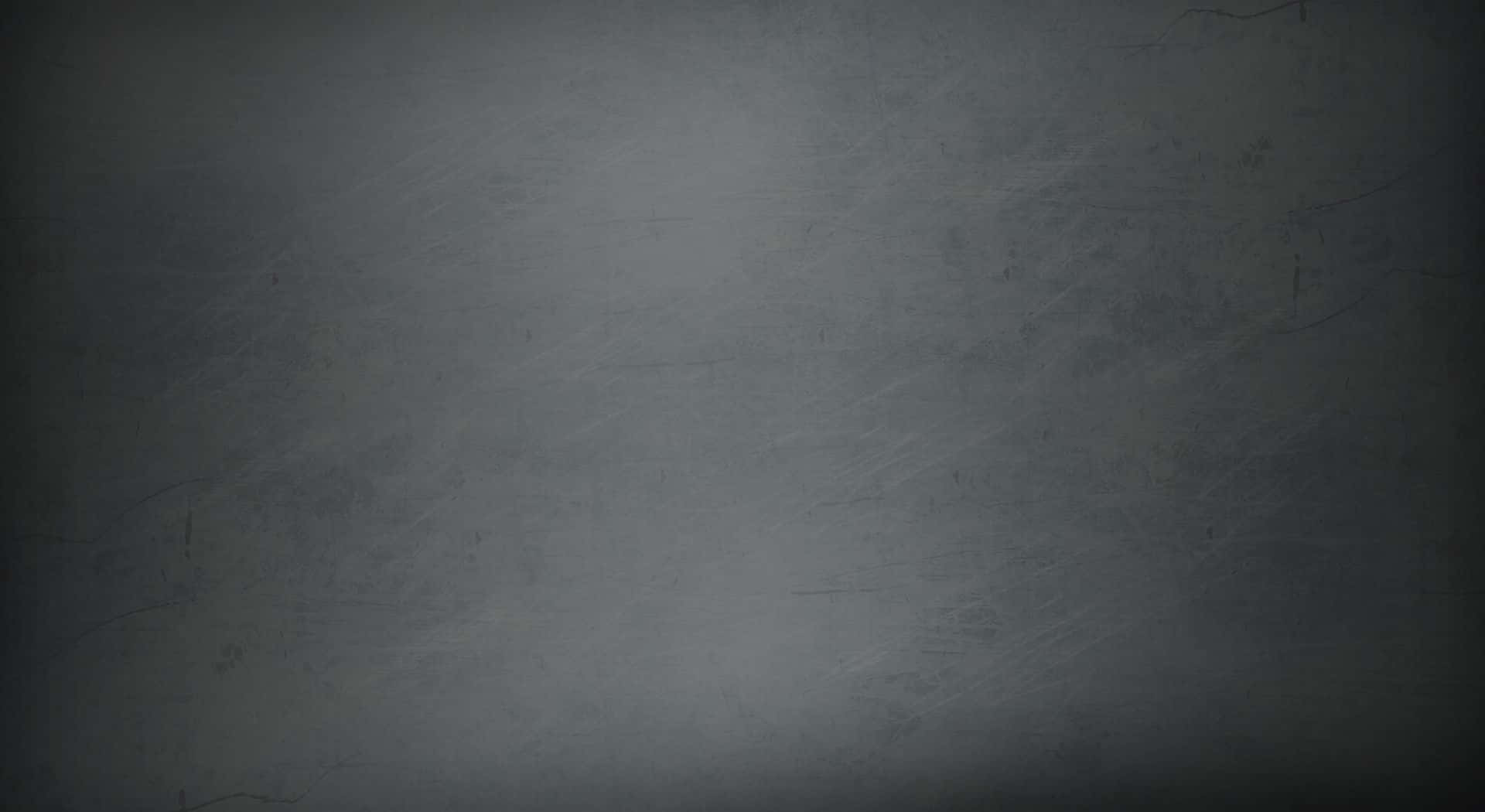 Dark Grey 桌布 壁紙 — 帶有細微刮痕和柔和漸變燈光效果的紋理深灰色牆壁。