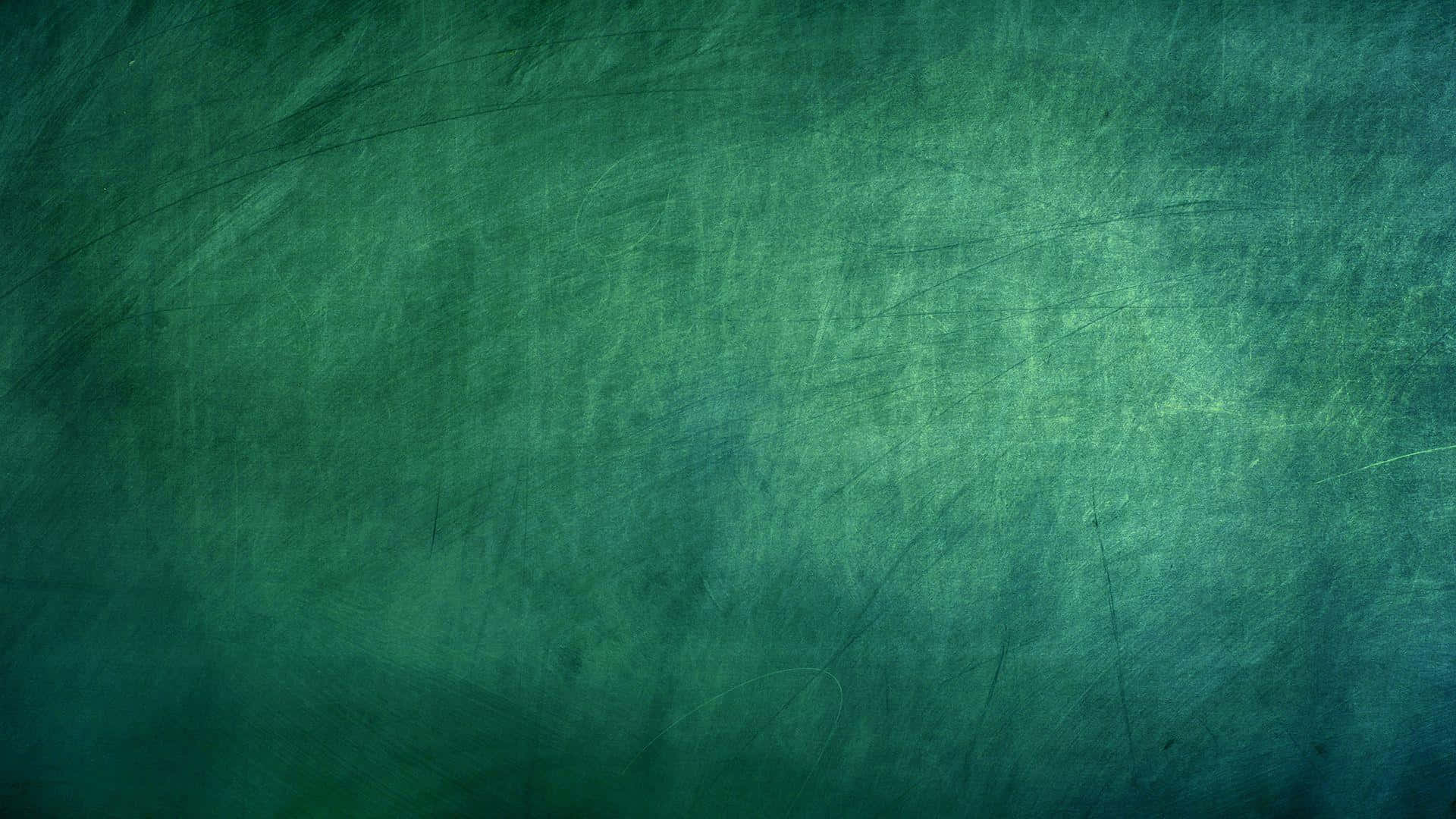 Blackboard 桌布 壁紙 — 帶有細微刮痕和漸變照明的紋理青綠色表面，營造出復古黑板效果。
