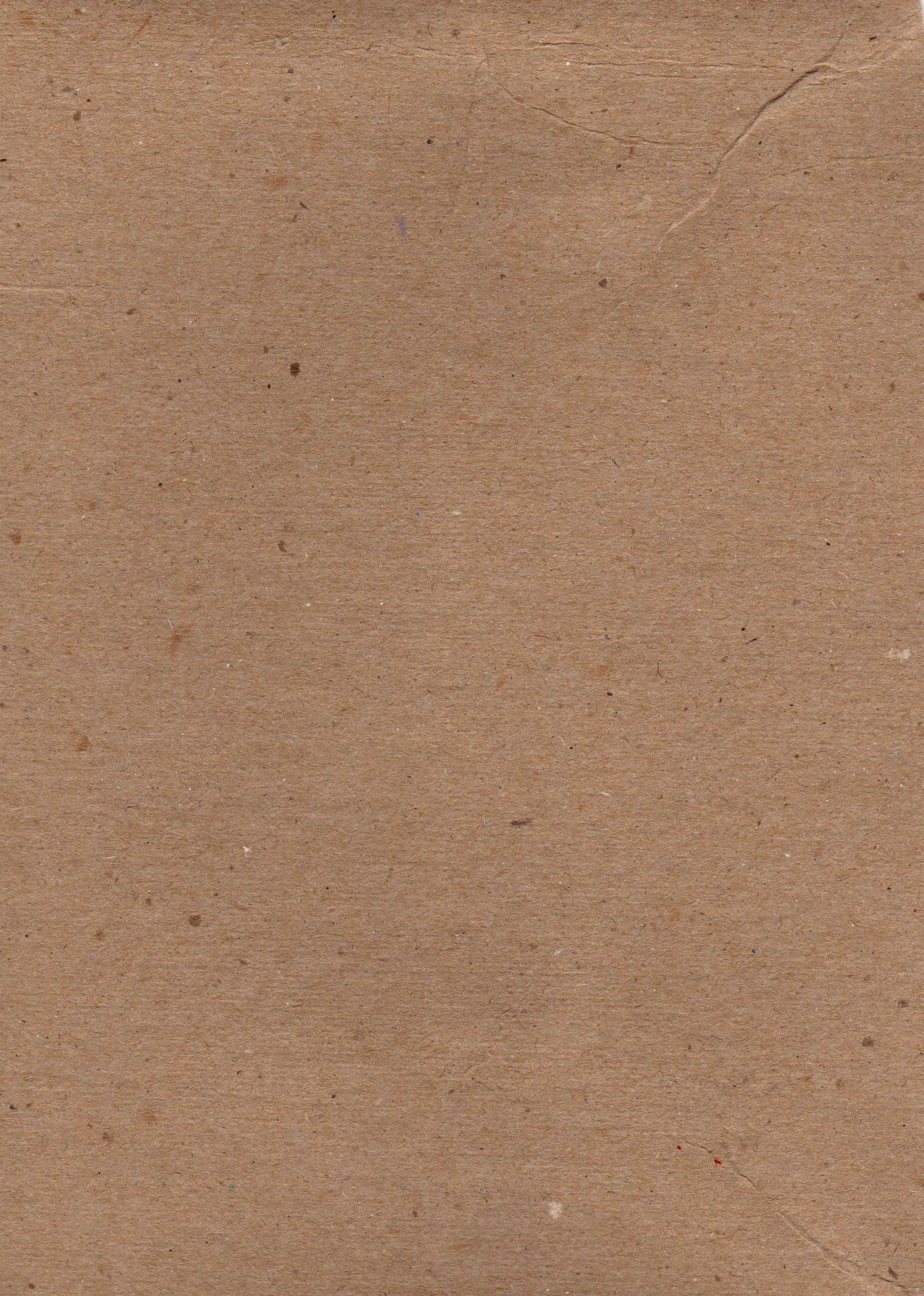 cardboard 桌布 壁紙 — 帶有細微摺痕和斑點、展現自然磨損的紋理棕色紙張特寫。