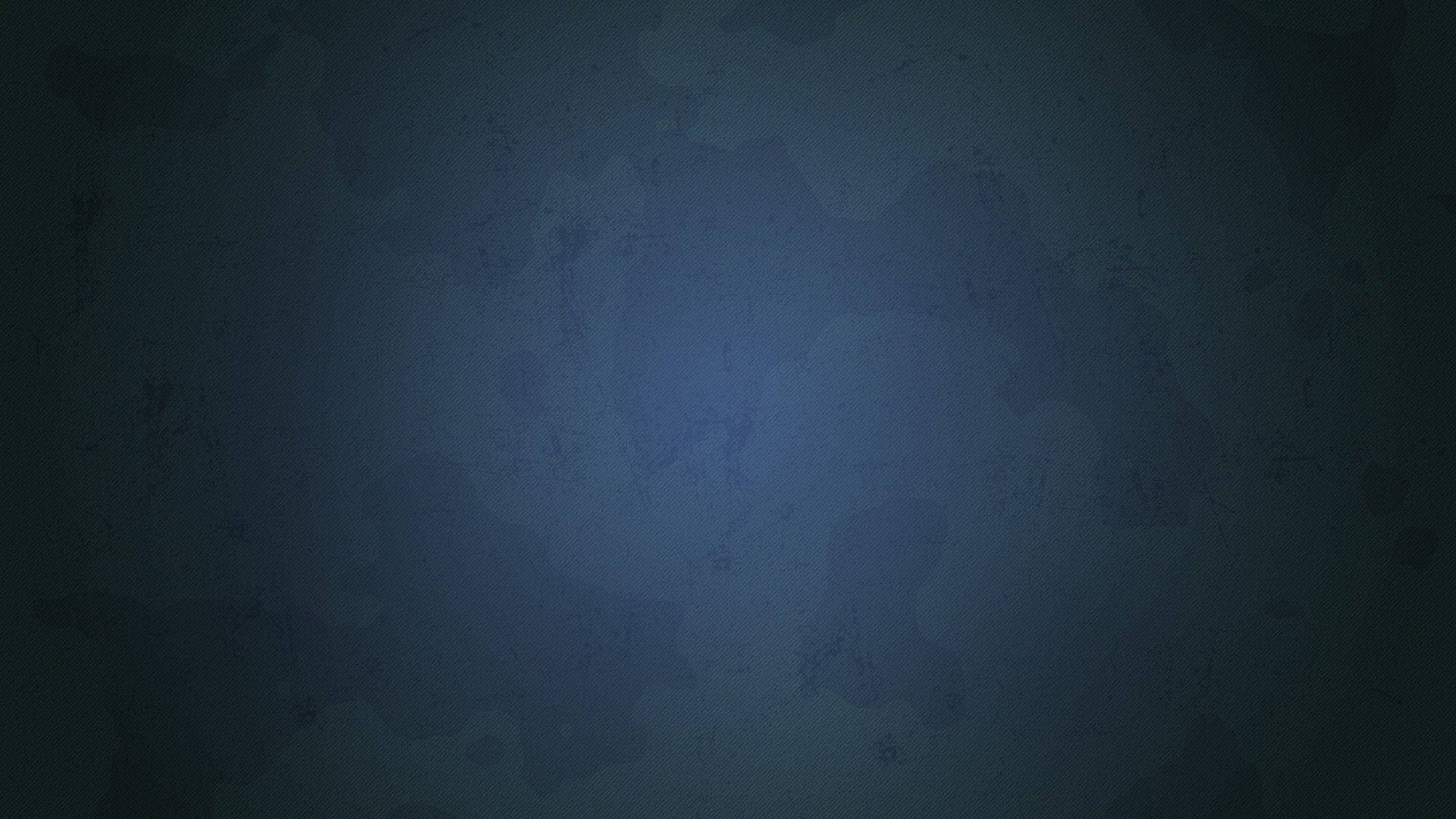 Gradient 桌布 壁紙 — 帶有細微斑駁圖案和柔和中心光芒的紋理深藍色漸變背景。