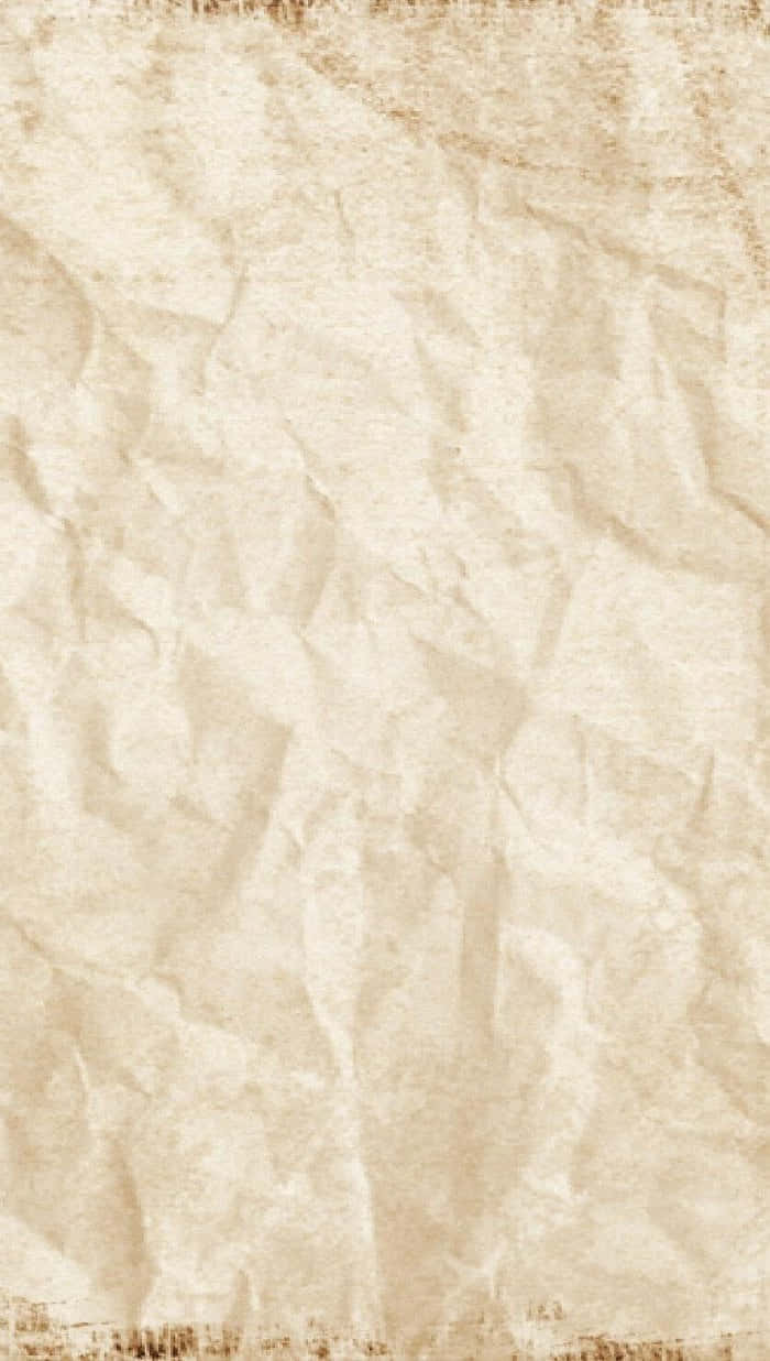 Old Paper 桌布 壁紙 — 帶有細微棕色污漬和摺痕的紋理米色皺紙特寫。