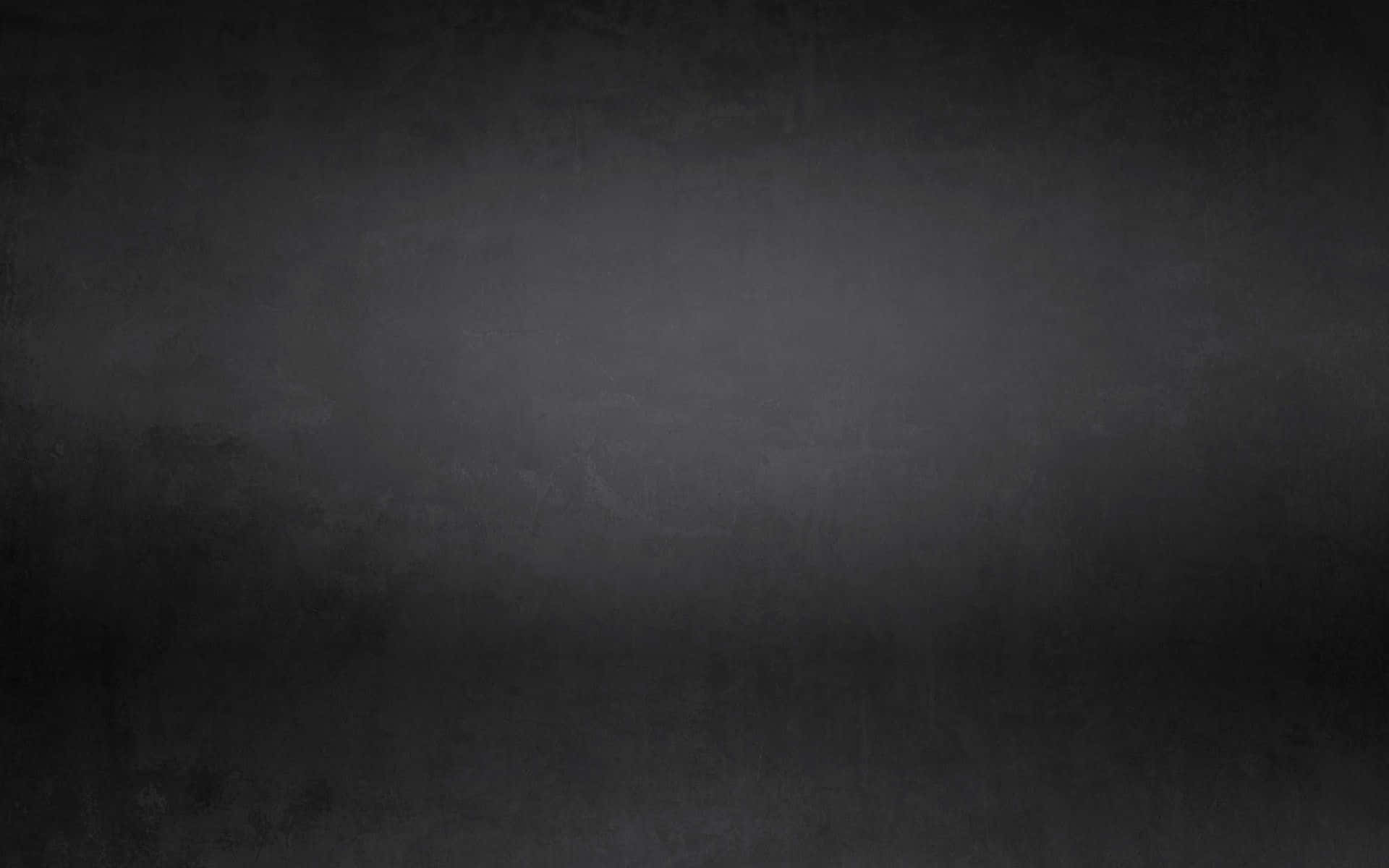 Dark Grunge 桌布 壁紙 — 帶有細微色調變化和柔和光線的紋理深灰色漸變背景。