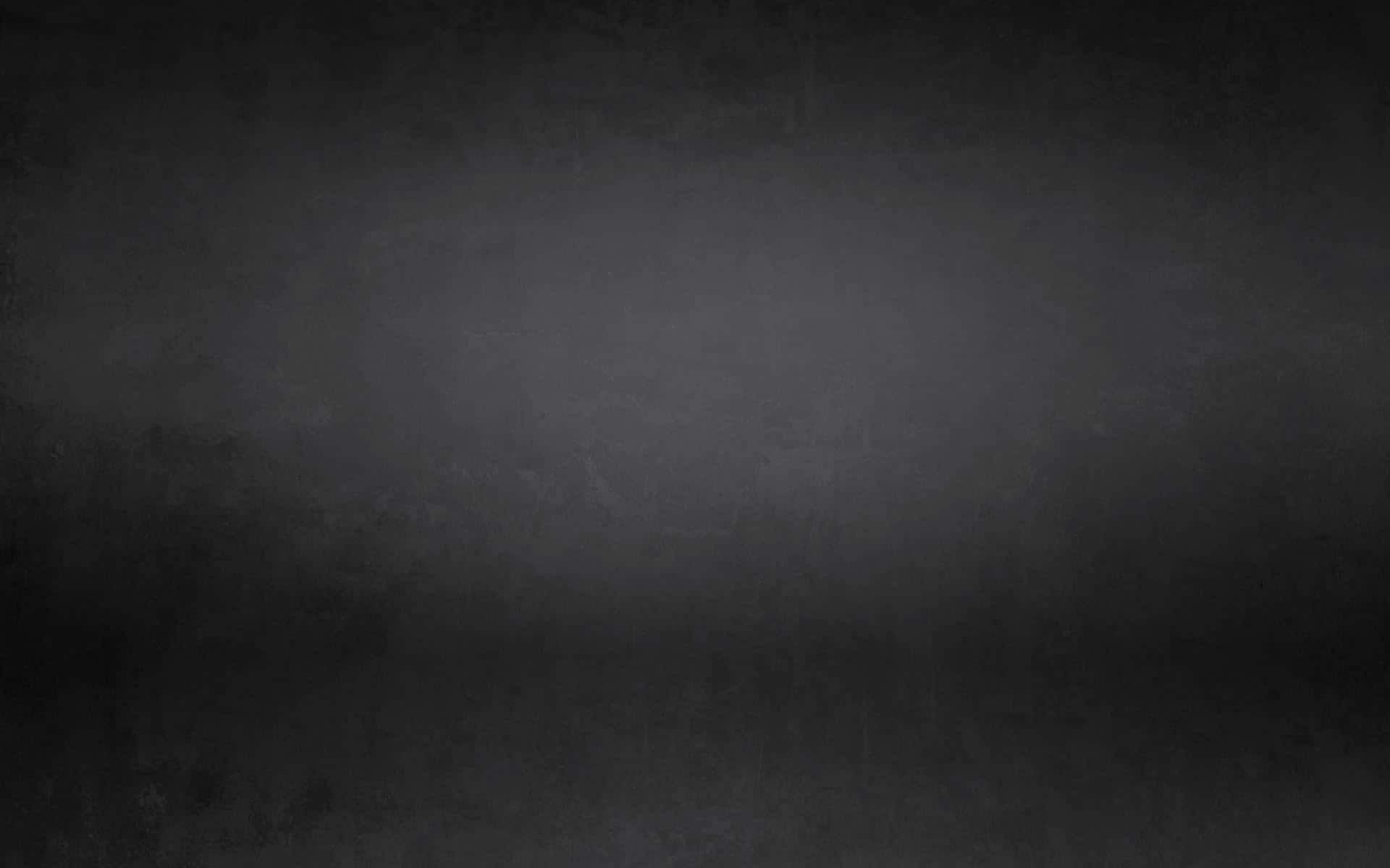 Black Grunge 桌布 壁紙 — 帶有細微色調變化和柔和暈影效果的紋理深灰色漸變背景。