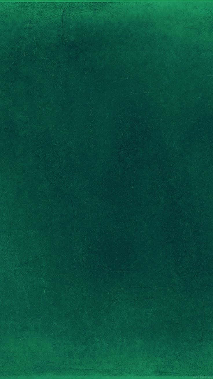 Dark Green Grunge 桌布 壁紙 — 帶有細微色調變化和表面輕微刮痕的紋理深綠色背景。