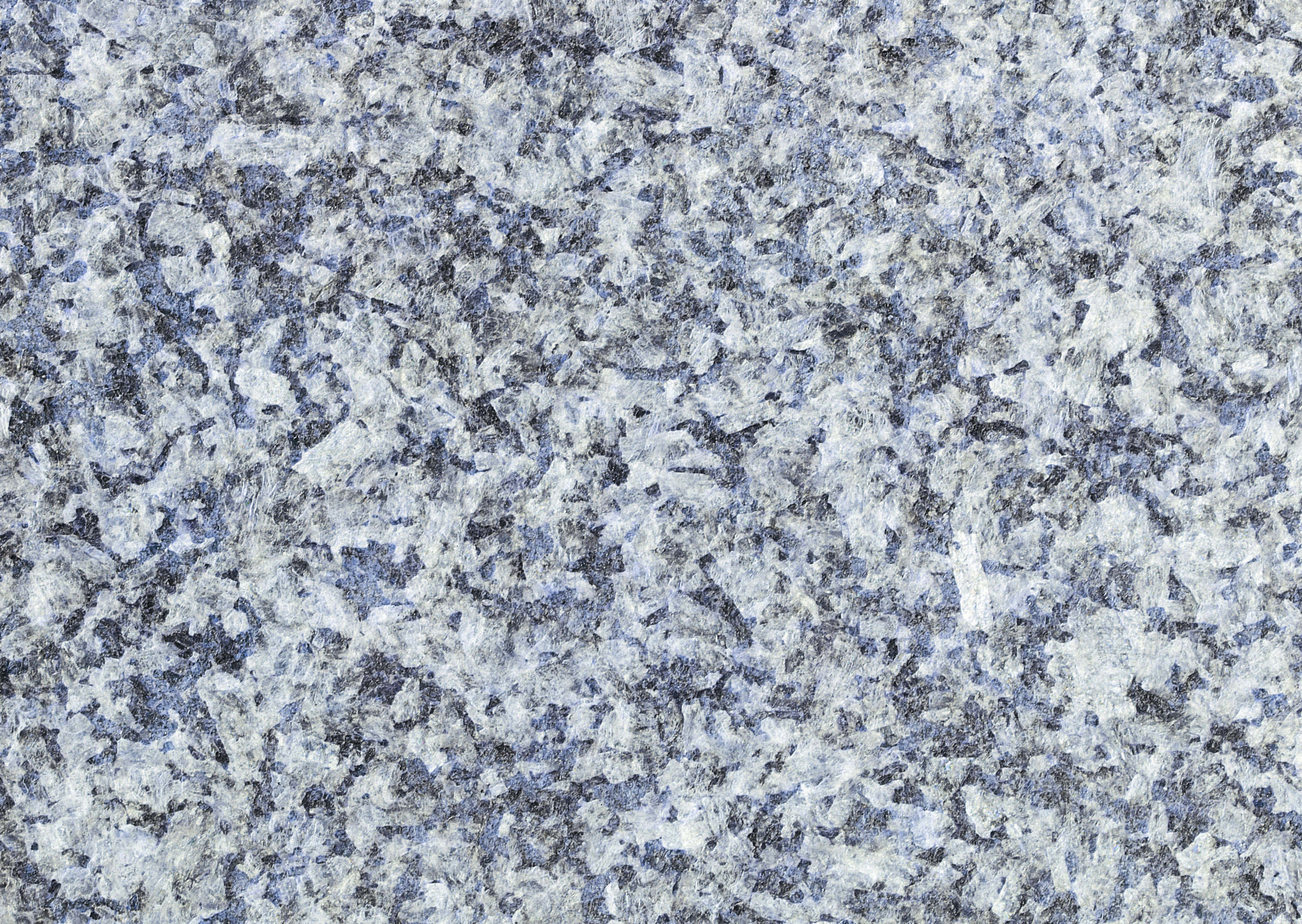 Granite 桌布 壁紙 — 帶有複雜礦物圖案和自然紋理的斑點藍灰色花崗岩表面的特寫。