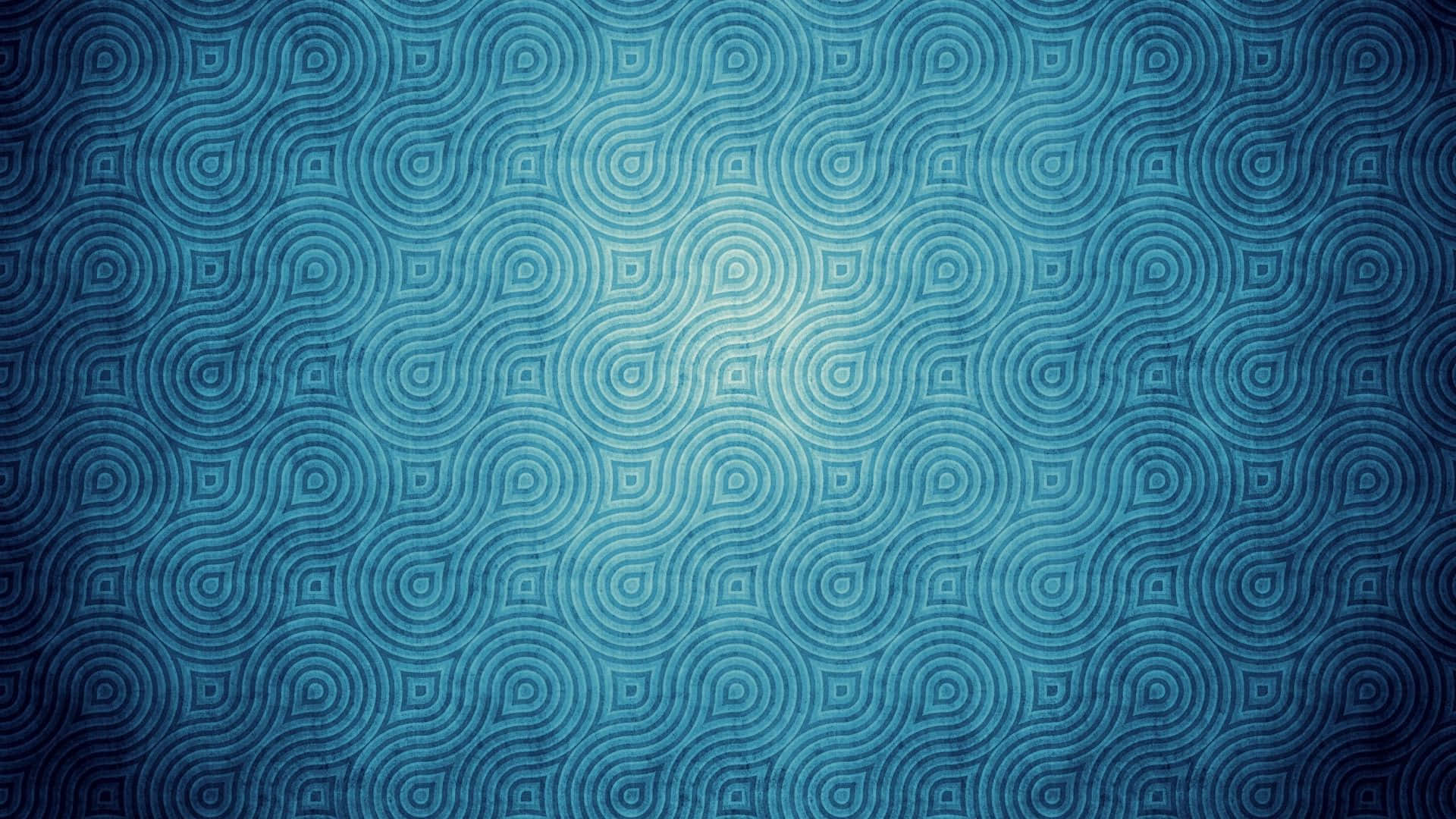 Pattern Desktop 桌布 壁紙 — 帶有重複同心圓圖案的紋理藍色壁紙，從深色中心漸變到淺色中心。