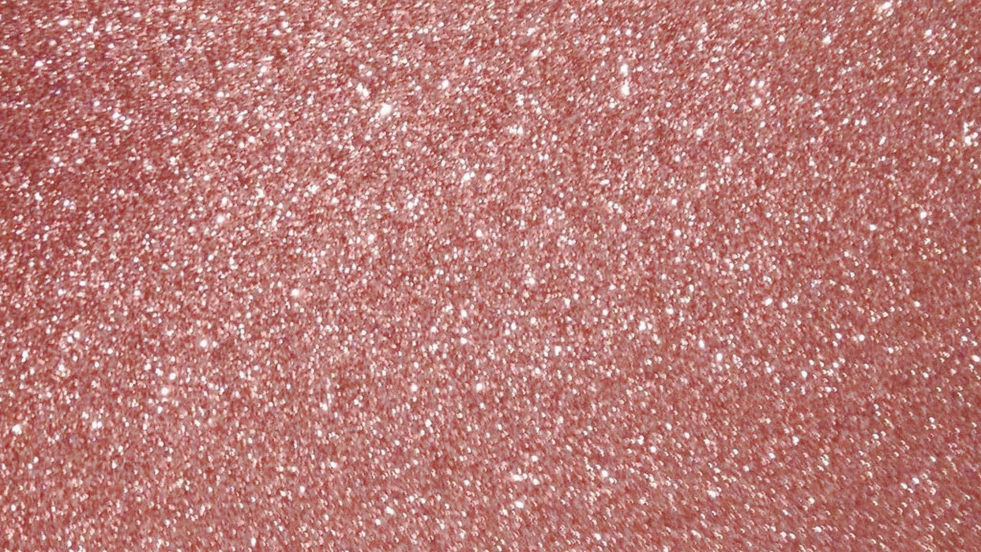 Rose Gold Desktop 桌布 壁紙 — 帶有閃爍白色顆粒的紋理粉紅閃粉表面特寫，顆粒捕捉光線。