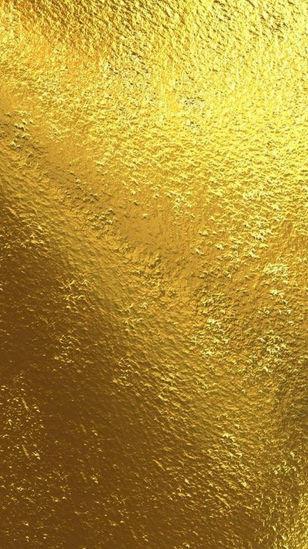 Foil 桌布 壁紙 — 帶有閃爍高光和微妙色調變化的紋理金箔特寫。