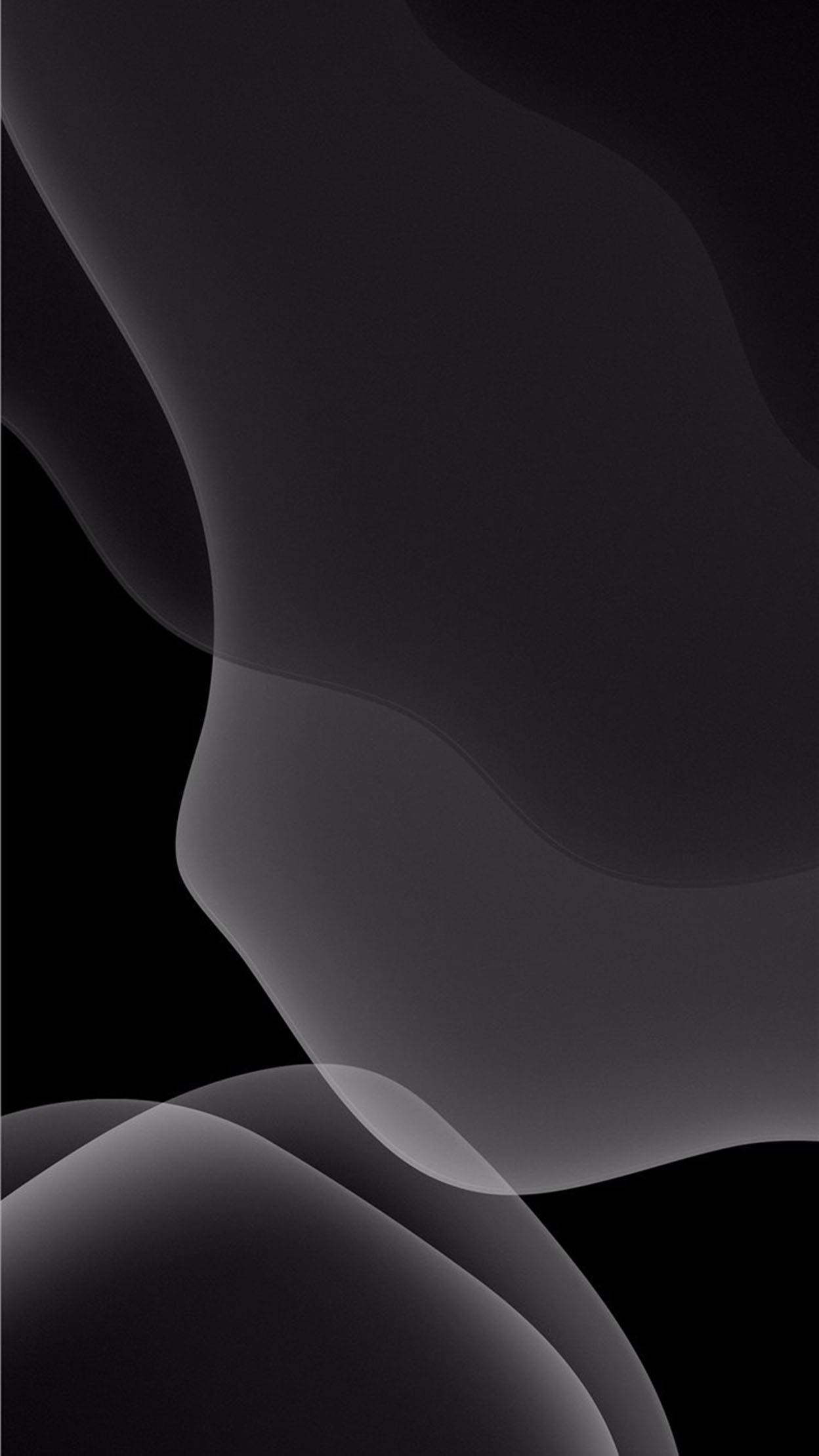 Black And Grey iPhone 桌布 壁紙 — 平滑流動的灰色抽象形狀在深黑色背景上飄移，創造出極簡主義的數位藝術作品。