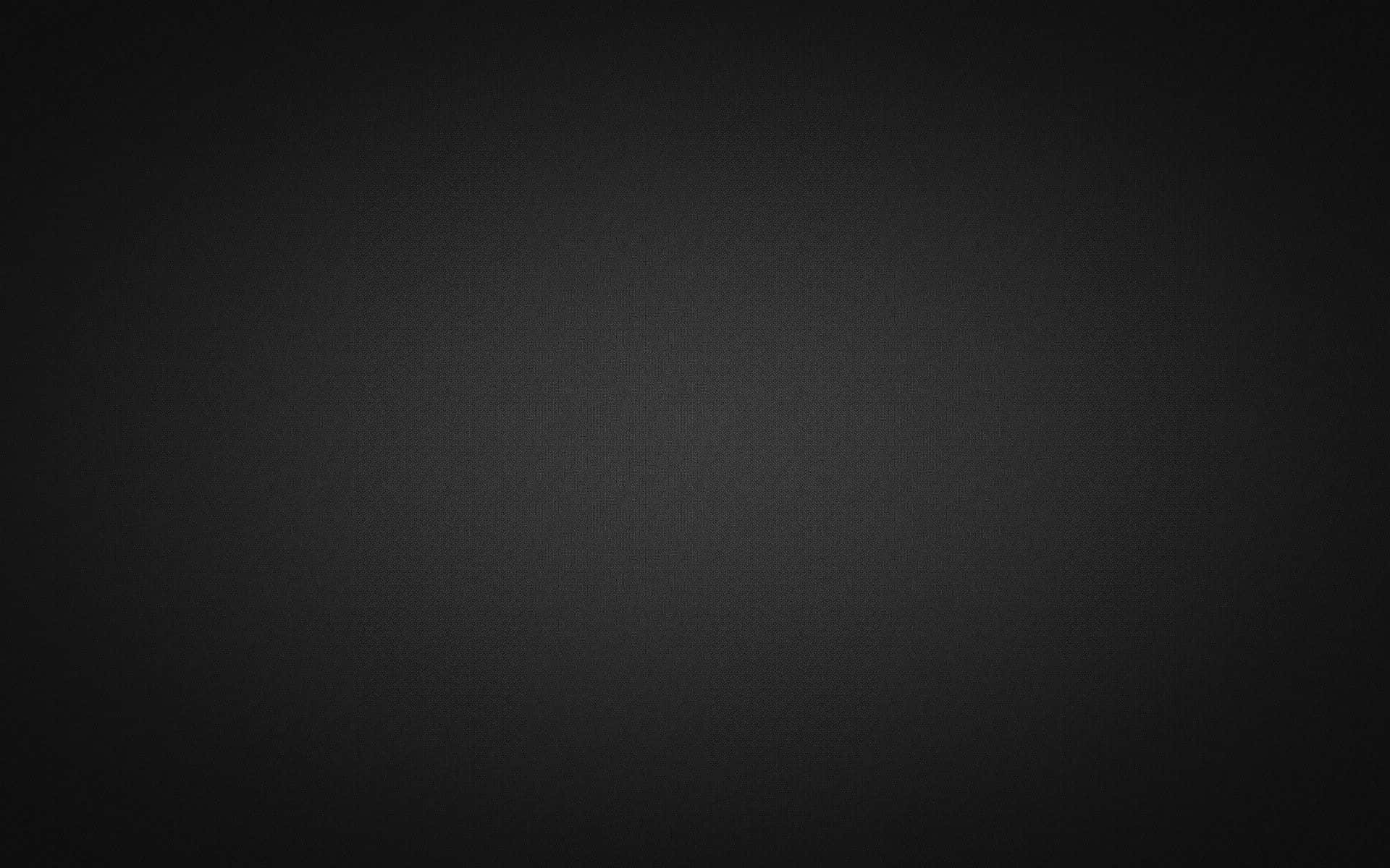 Grey Gradient 桌布 壁紙 — 平滑深灰色漸變背景，帶有細微紋理和從中心到邊緣柔和淡出的光線。