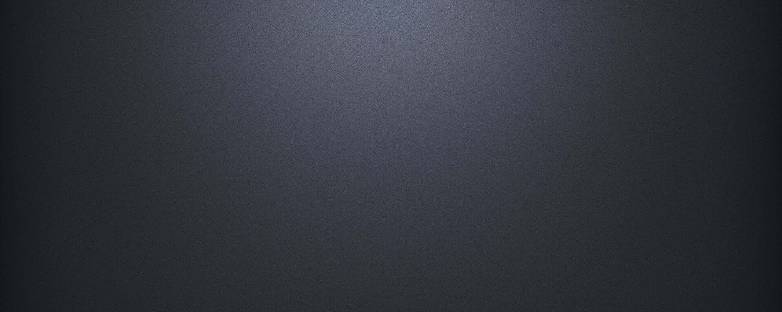 Dark Grey 桌布 壁紙 — 平滑深灰色漸變背景，頂部中央有微妙的光線衰減。