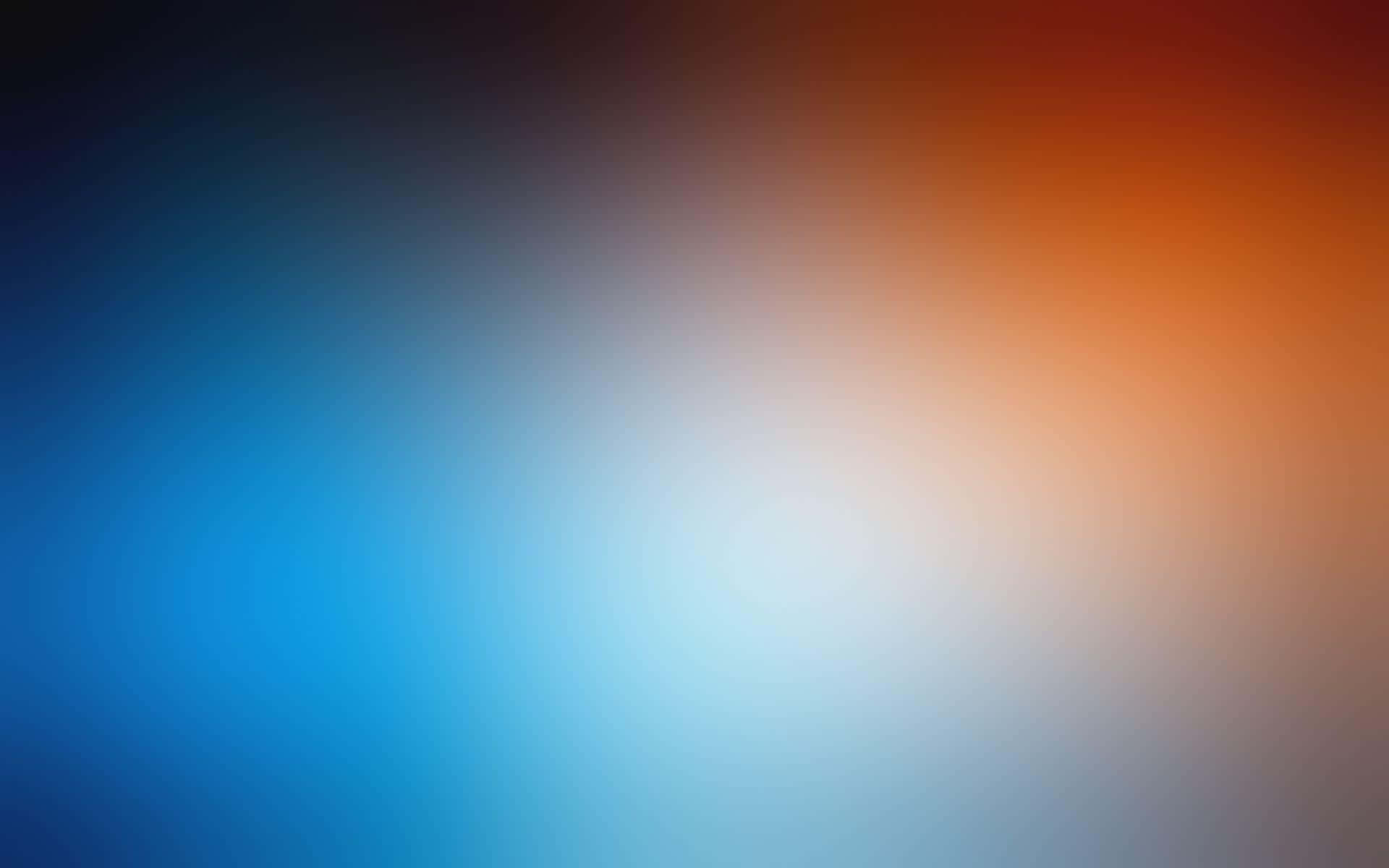 Orange And Blue 桌布 壁紙 — 平滑漸層從深藍色過渡到溫暖的橙色，明亮的白色中心營造出平靜的抽象光芒。