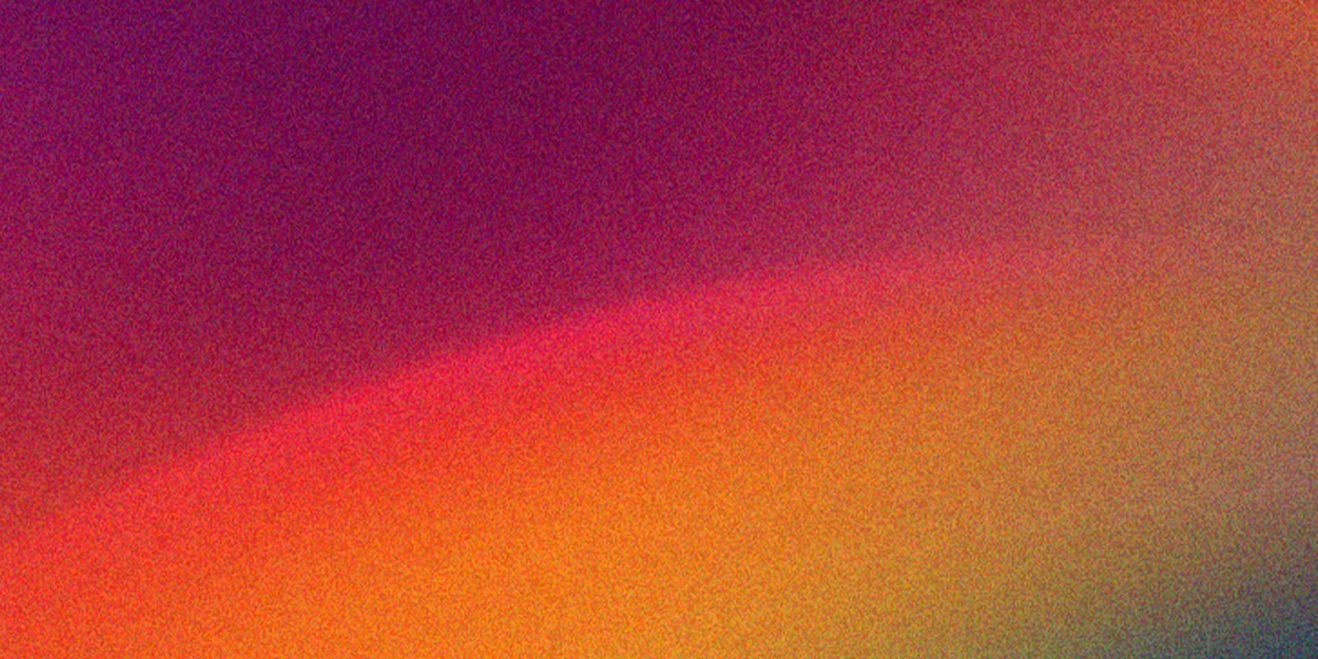 Abstract Colorful Gradient Background Texture with Subtle Noise 壁紙 — 平滑漸變從深洋紅色過渡到火橙色，在紋理表面上。