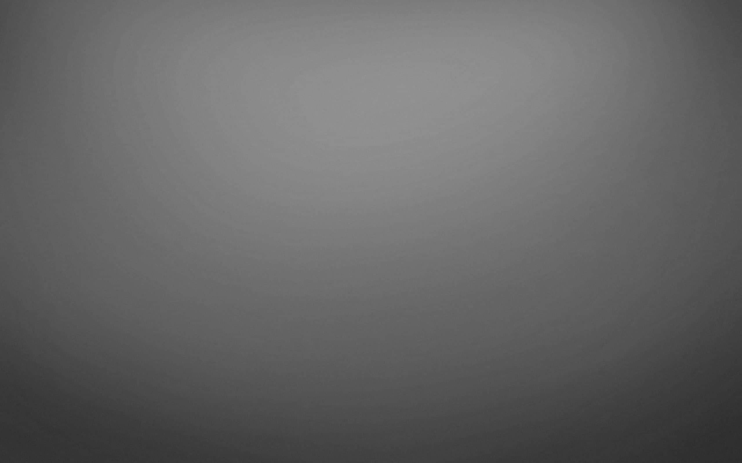 Gradient 桌布 壁紙 — 平滑灰色漸變背景，帶有從淺到深的微妙色調變化。