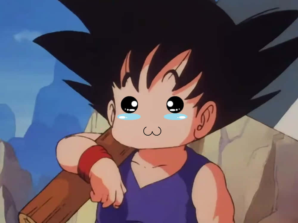 Funny Goku 桌布 壁紙 — 年輕的悟空睜大眼睛哭泣，手持木杖，背景是岩石山脈。