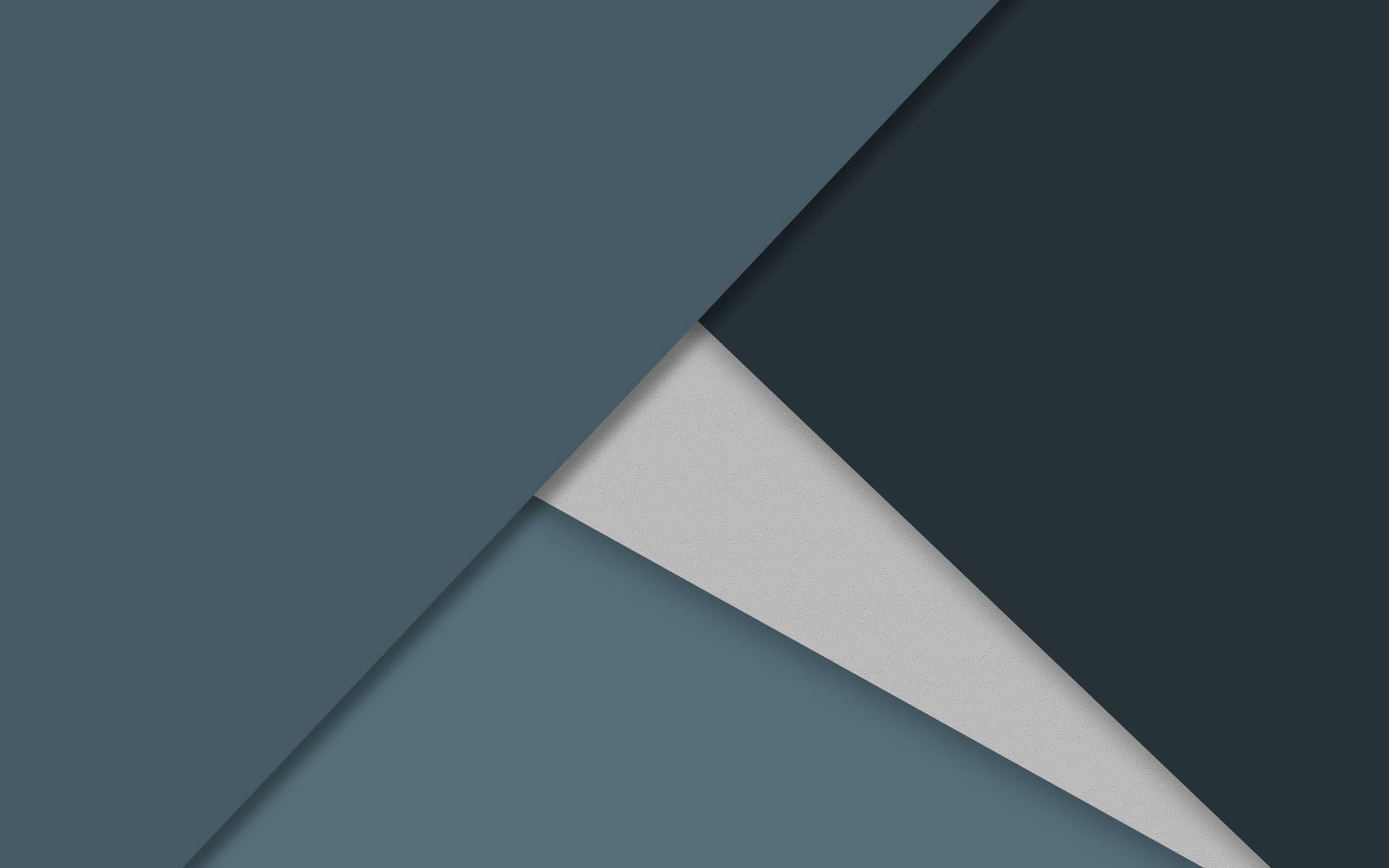 Android Material Design 桌布 壁紙 — 幾何抽象壁紙，採用霧面紙三角形重疊，色調柔和，呈現灰綠色和炭灰色。