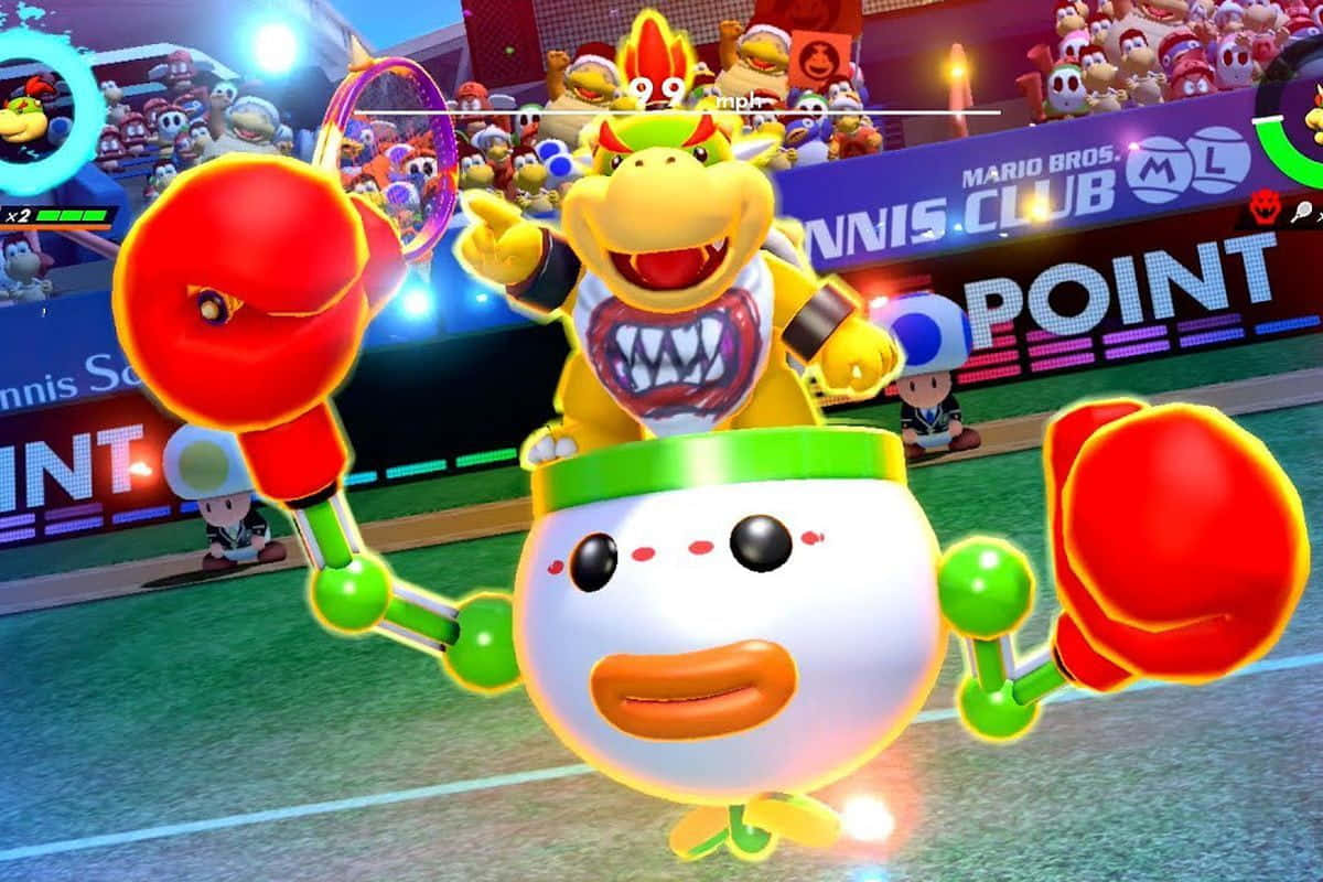 Bowser Jr 桌布 壁紙 — 庫巴在一個充滿活力的球場上，與一個揮舞著超大紅色拳擊手套的巨大蛋角色進行網球比賽。