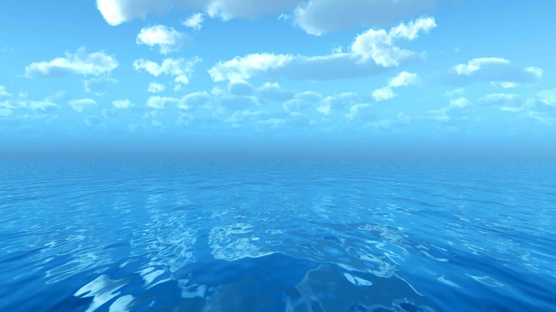 Ocean Water 桌布 壁紙 — 廣闊平靜的海洋在明亮的藍天下延伸至地平線，點綴著蓬鬆的白雲。