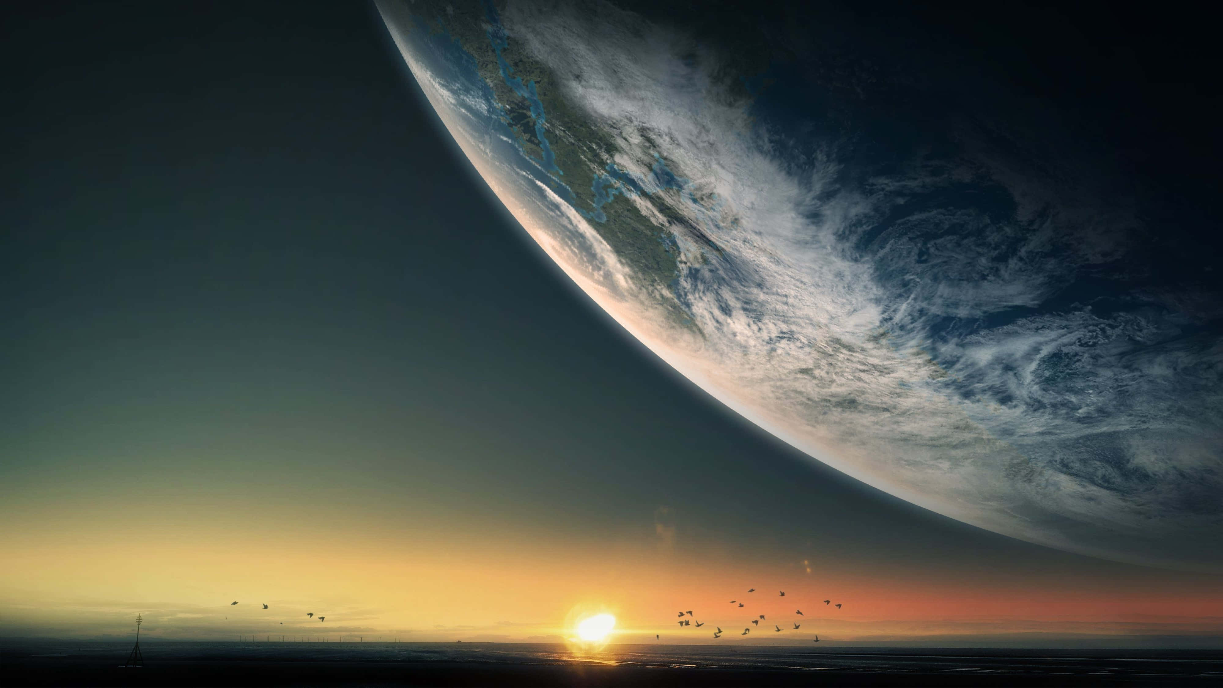 4K UHD 桌布 壁紙 — 廣闊海洋上令人驚嘆的日落，巨大的彎曲地球主宰著天空。