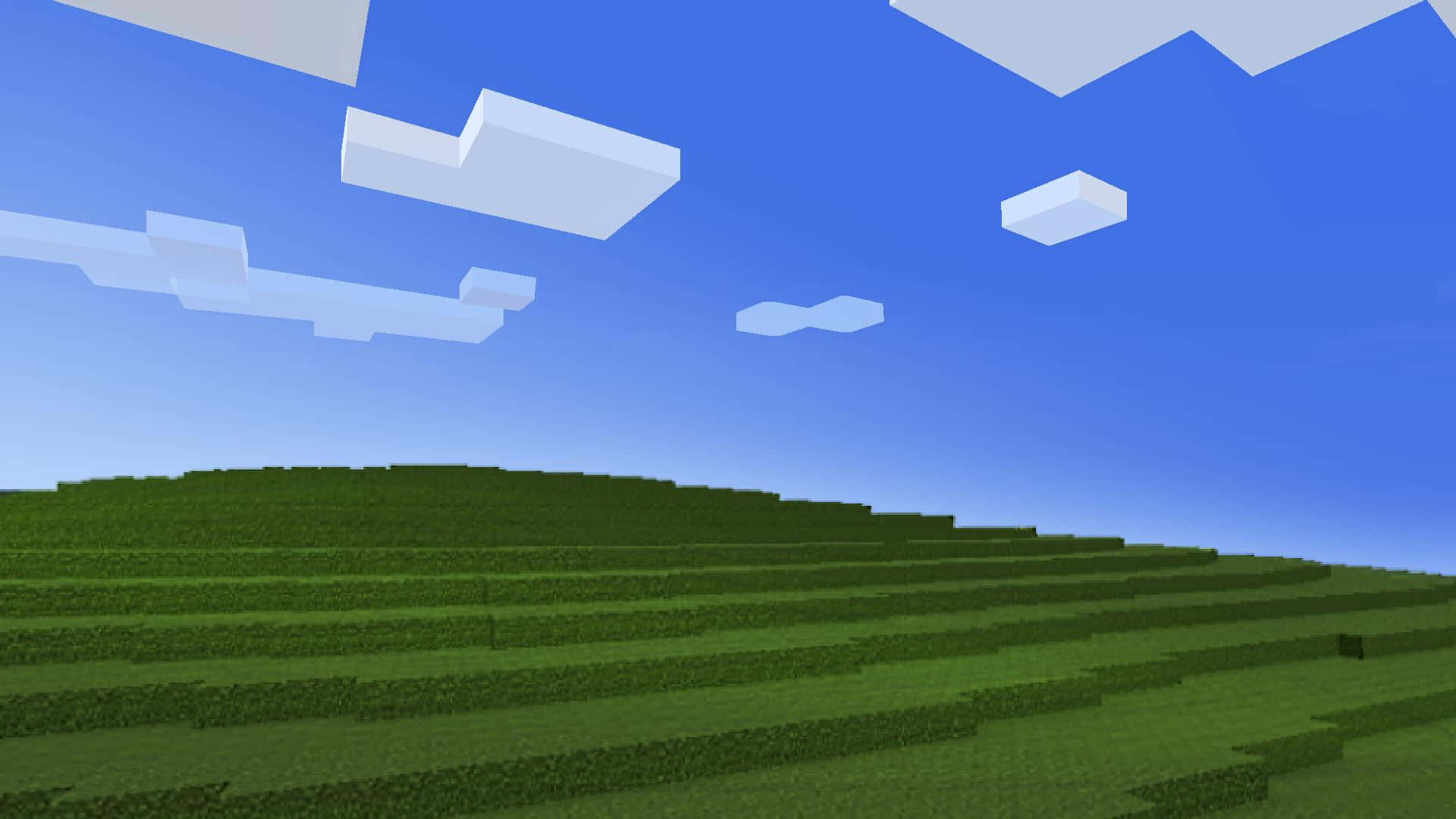  壁紙 — 廣闊的像素化綠色山丘在Minecraft景觀中延伸，天空湛藍，白雲塊狀。