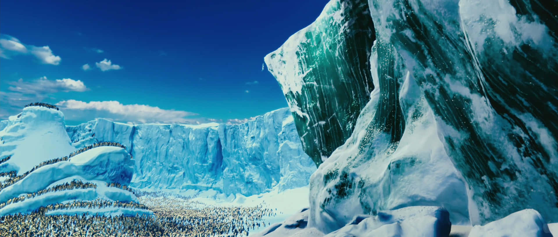 Animation 桌布 壁紙 — 廣闊的冰雪景觀，高聳的藍色冰川和一群企鵝在白雪覆蓋的地形上，在明亮的藍天下。