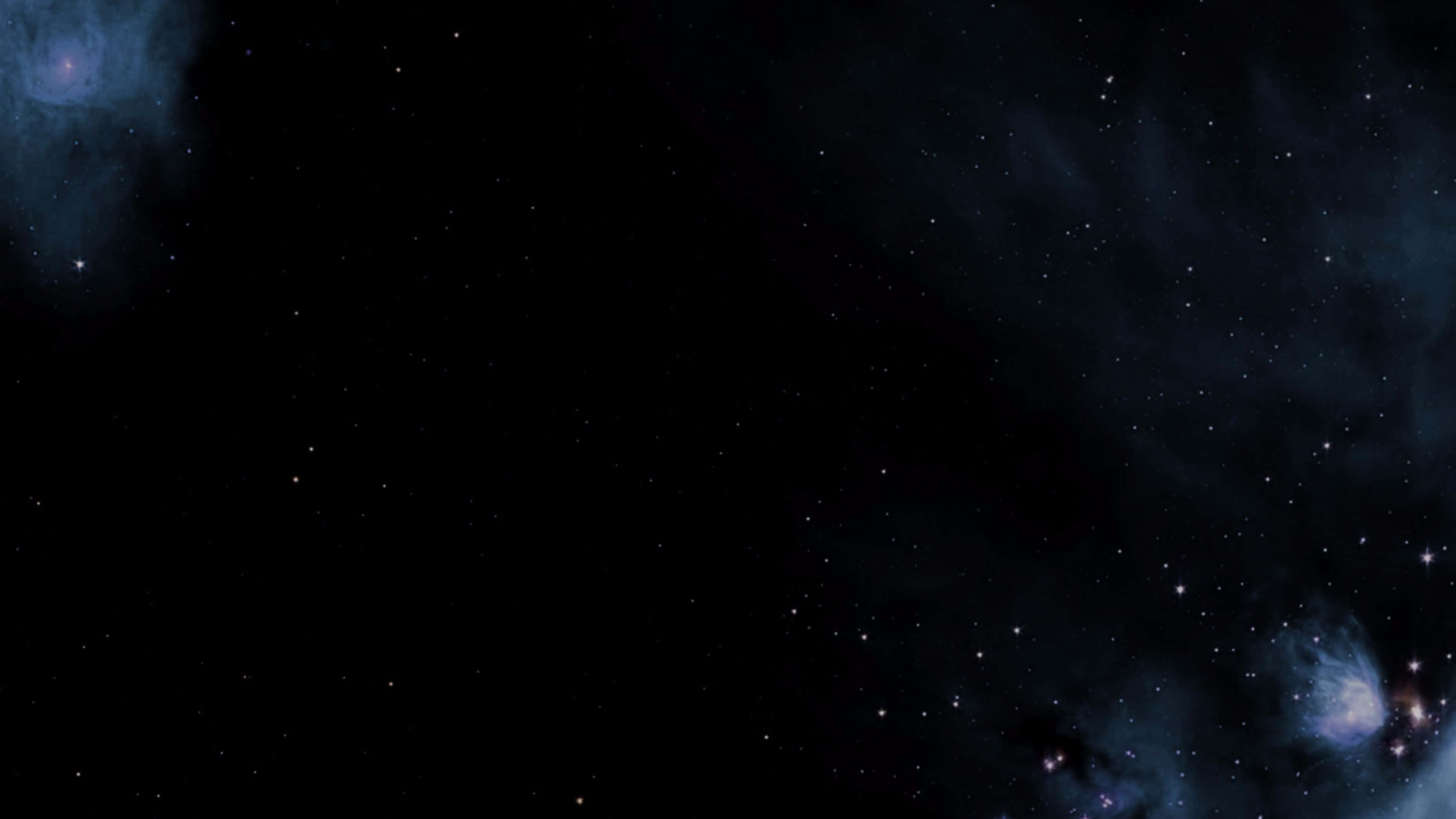 桌布 壁紙 — 廣闊的宇宙場景，充滿閃爍的星星和發光的藍色星雲，背景是深邃的黑色虛空。