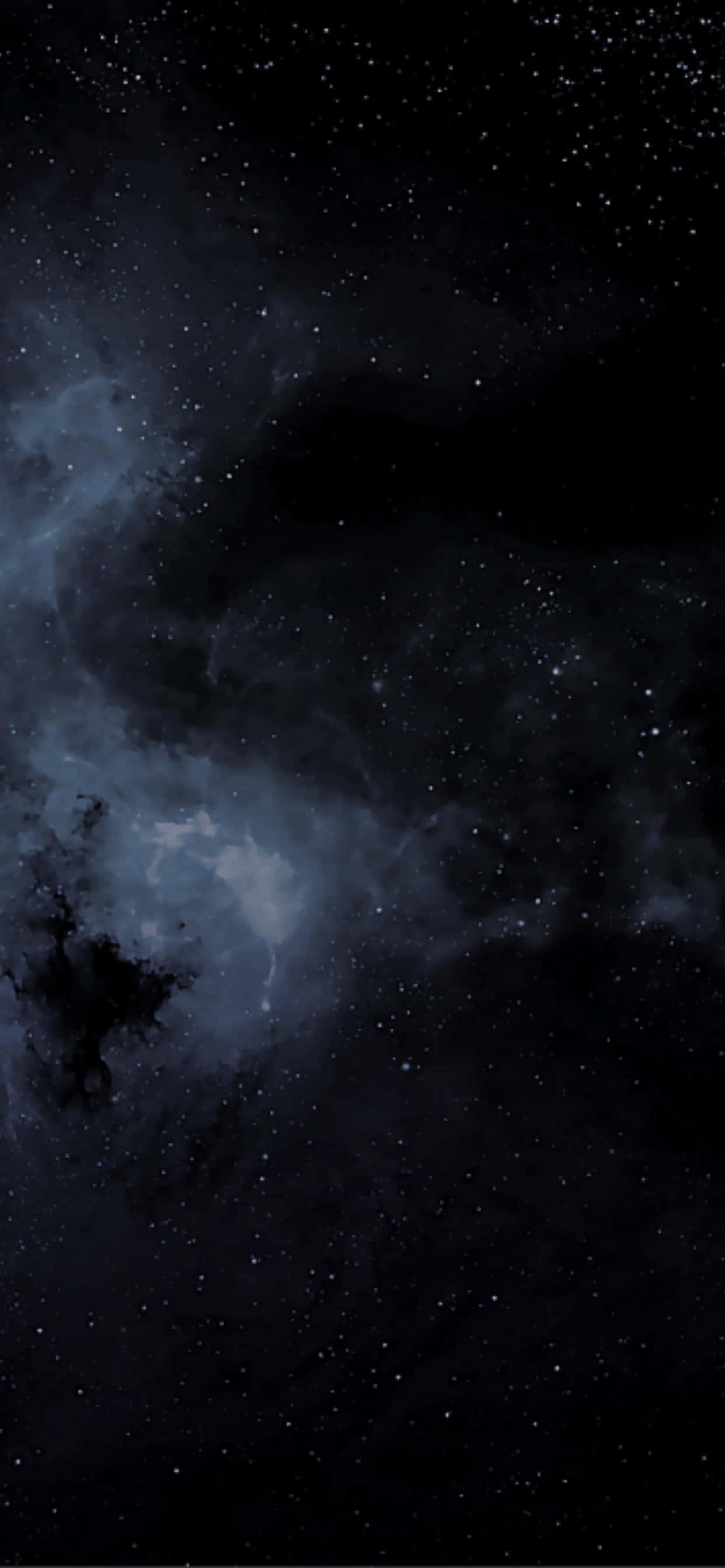 iPhone Xs Max Amoled 桌布 壁紙 — 廣闊的宇宙場景，充滿閃爍的星星和旋轉的深藍色星雲，背景是深邃的黑色虛空。