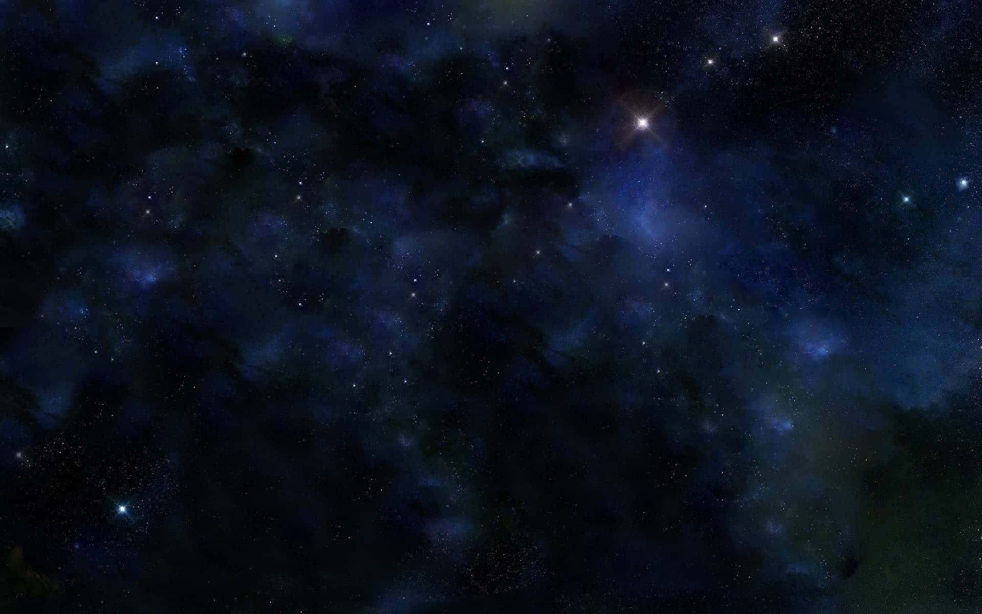 太空 桌布 壁紙 — 廣闊的宇宙空間，充滿了深藍色和紫色調中發光的星星和旋轉的星雲。