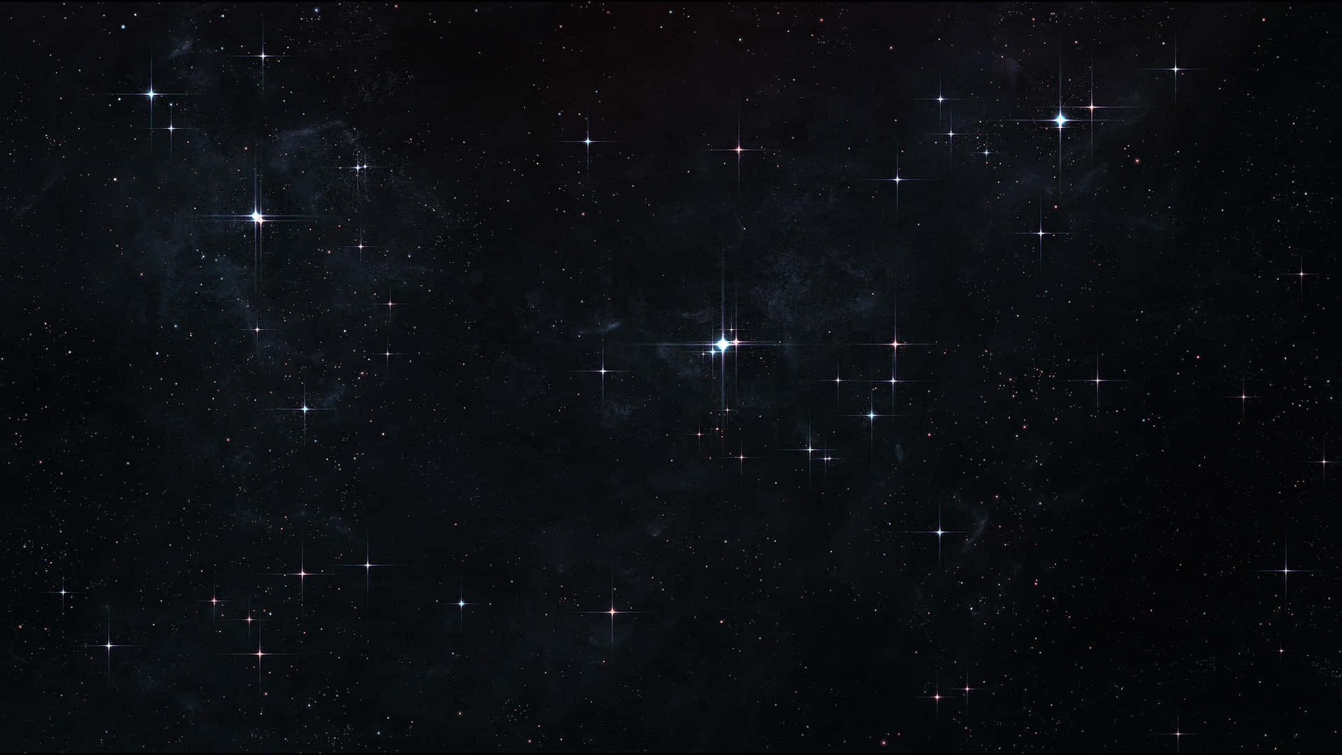 Deep Space 桌布 壁紙 — 廣闊的宇宙空間，充滿了閃爍的星星和微妙的星雲，在深邃的黑色虛空中發光。