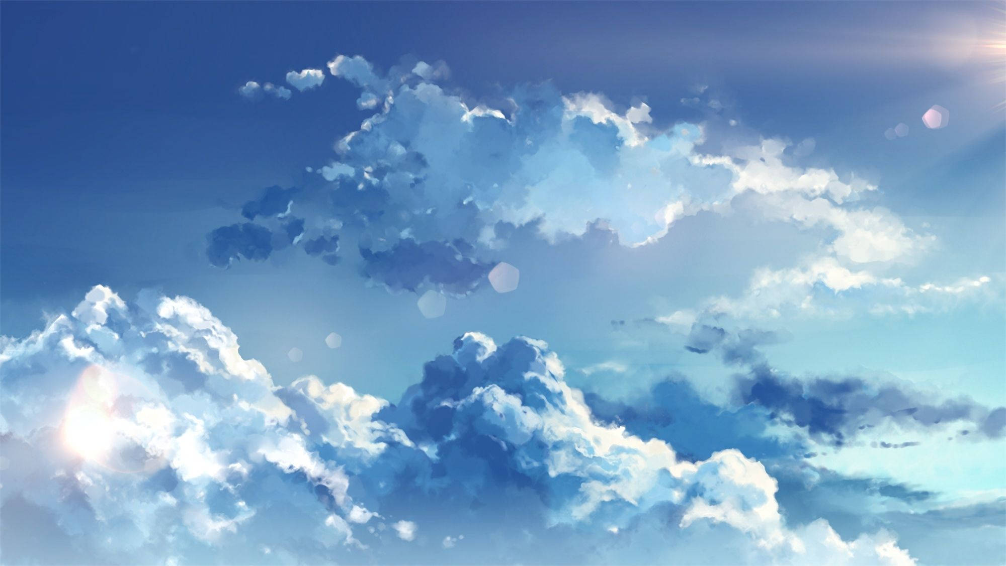 Aesthetic Cloud 桌布 壁紙 — 廣闊的藍天，充滿蓬鬆的白雲，被明亮的陽光和鏡頭光暈照亮。
